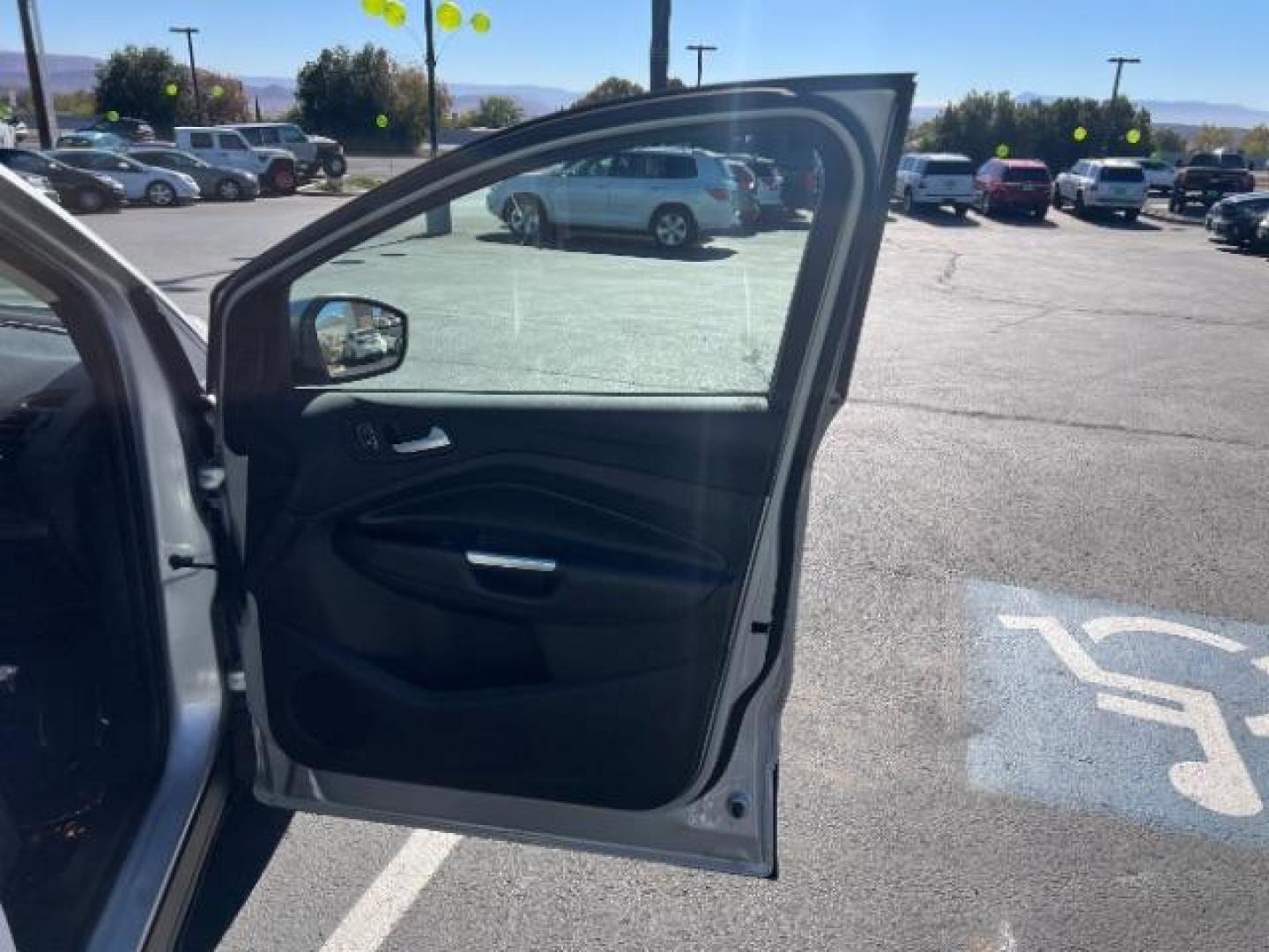 2017 Ingot Silver Metallic /Medium Light Stone Ford Escape SE (1FMCU9G96HU) with an EcoBoost 1.5L I-4 gasoline direct injection engine, Automatic transmission, located at 940 North Main Street, Cedar City, UT, 84720, (435) 628-0023, 37.692936, -113.061897 - Photo#26