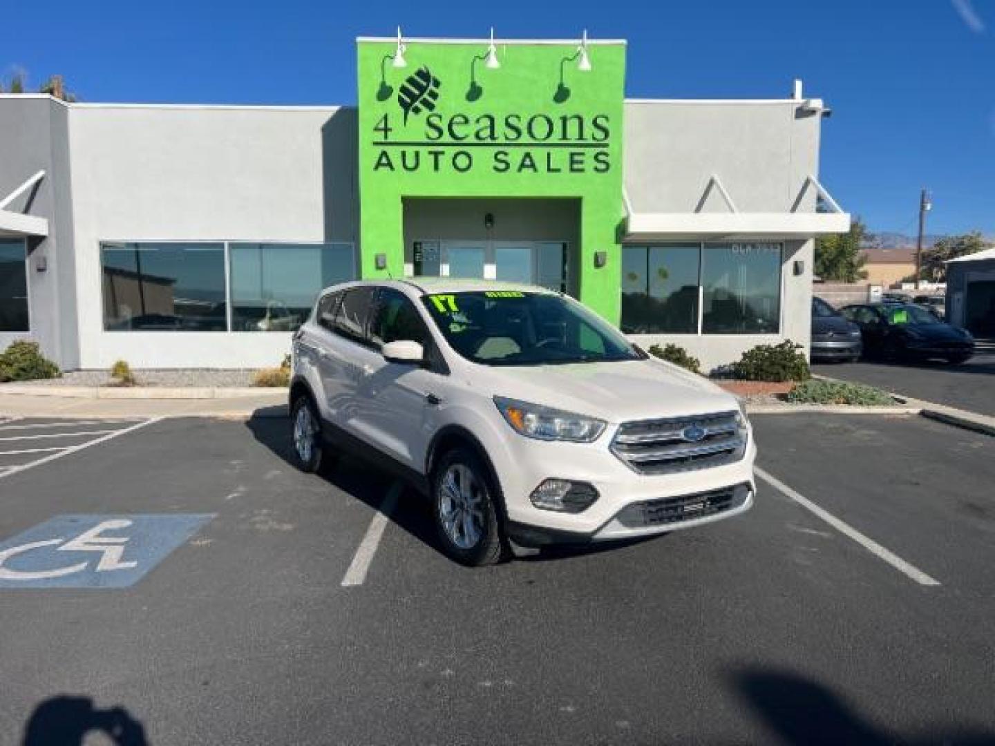2017 Oxford White /Medium Light Stone Ford Escape SE (1FMCU0G91HU) with an EcoBoost 1.5L I-4 gasoline direct injection engine, Automatic transmission, located at 1865 East Red Hills Pkwy, St. George, 84770, (435) 628-0023, 37.120850, -113.543640 - We specialize in helping ALL people get the best financing available. No matter your credit score, good, bad or none we can get you an amazing rate. Had a bankruptcy, divorce, or repossessions? We give you the green light to get your credit back on the road. Low down and affordable payments that fit - Photo#0