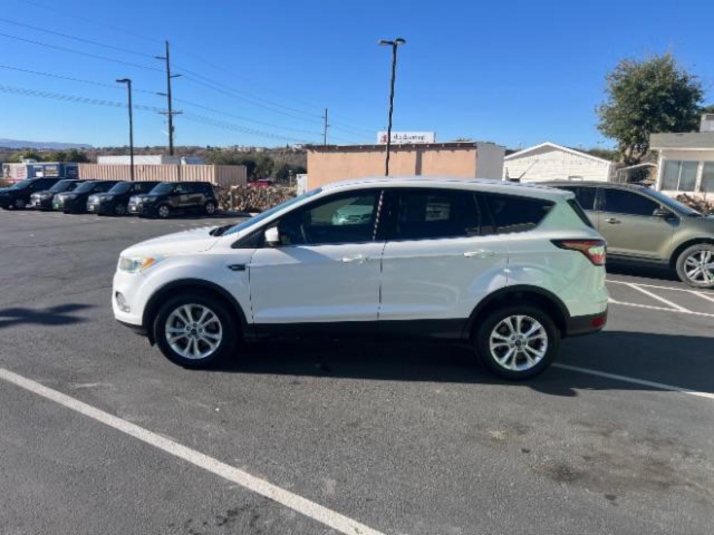 2017 Oxford White /Medium Light Stone Ford Escape SE (1FMCU0G91HU) with an EcoBoost 1.5L I-4 gasoline direct injection engine, Automatic transmission, located at 1865 East Red Hills Pkwy, St. George, 84770, (435) 628-0023, 37.120850, -113.543640 - We specialize in helping ALL people get the best financing available. No matter your credit score, good, bad or none we can get you an amazing rate. Had a bankruptcy, divorce, or repossessions? We give you the green light to get your credit back on the road. Low down and affordable payments that fit - Photo#3