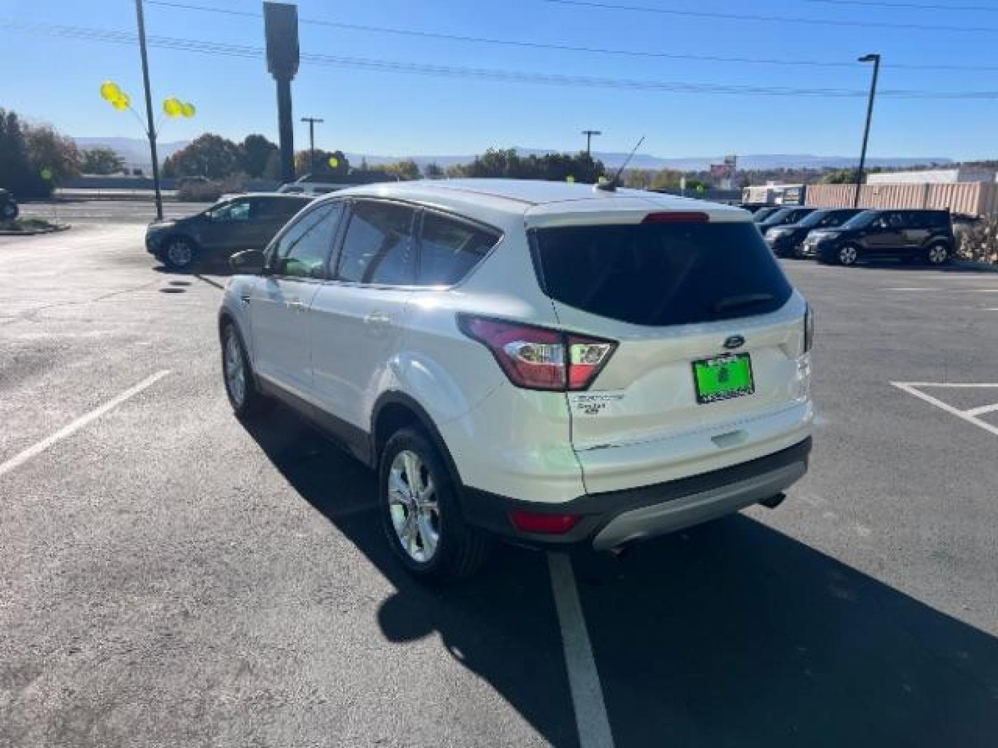 2017 Oxford White /Medium Light Stone Ford Escape SE (1FMCU0G91HU) with an EcoBoost 1.5L I-4 gasoline direct injection engine, Automatic transmission, located at 1865 East Red Hills Pkwy, St. George, 84770, (435) 628-0023, 37.120850, -113.543640 - We specialize in helping ALL people get the best financing available. No matter your credit score, good, bad or none we can get you an amazing rate. Had a bankruptcy, divorce, or repossessions? We give you the green light to get your credit back on the road. Low down and affordable payments that fit - Photo#4