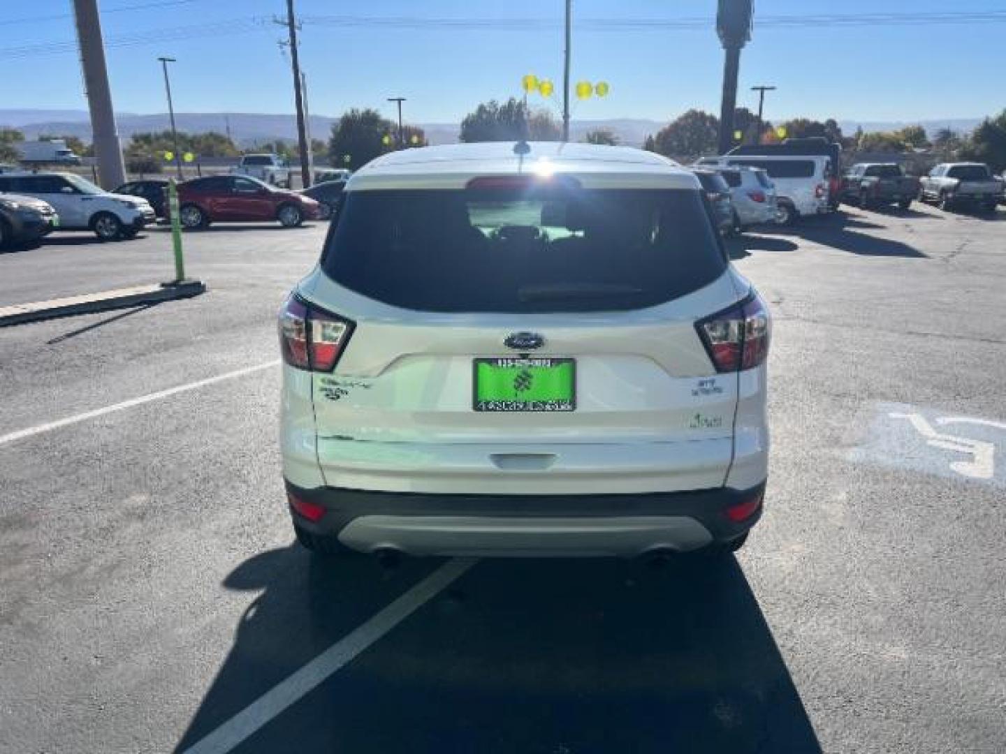 2017 Oxford White /Medium Light Stone Ford Escape SE (1FMCU0G91HU) with an EcoBoost 1.5L I-4 gasoline direct injection engine, Automatic transmission, located at 1865 East Red Hills Pkwy, St. George, 84770, (435) 628-0023, 37.120850, -113.543640 - We specialize in helping ALL people get the best financing available. No matter your credit score, good, bad or none we can get you an amazing rate. Had a bankruptcy, divorce, or repossessions? We give you the green light to get your credit back on the road. Low down and affordable payments that fit - Photo#5