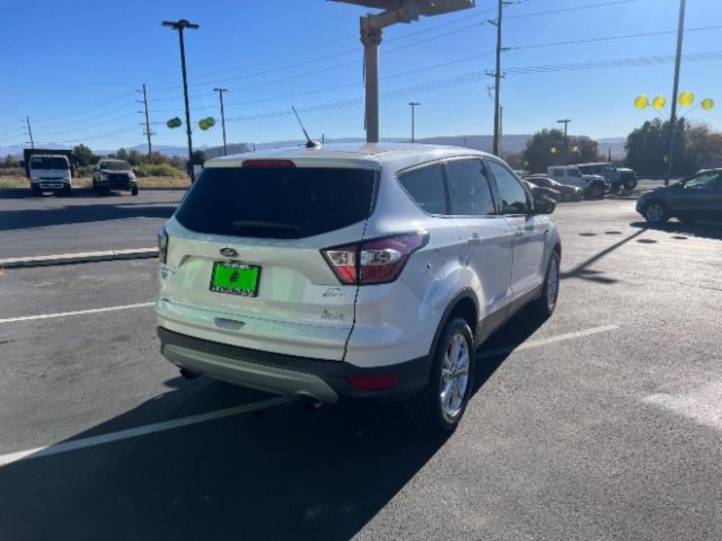 2017 Oxford White /Medium Light Stone Ford Escape SE (1FMCU0G91HU) with an EcoBoost 1.5L I-4 gasoline direct injection engine, Automatic transmission, located at 1865 East Red Hills Pkwy, St. George, 84770, (435) 628-0023, 37.120850, -113.543640 - We specialize in helping ALL people get the best financing available. No matter your credit score, good, bad or none we can get you an amazing rate. Had a bankruptcy, divorce, or repossessions? We give you the green light to get your credit back on the road. Low down and affordable payments that fit - Photo#6