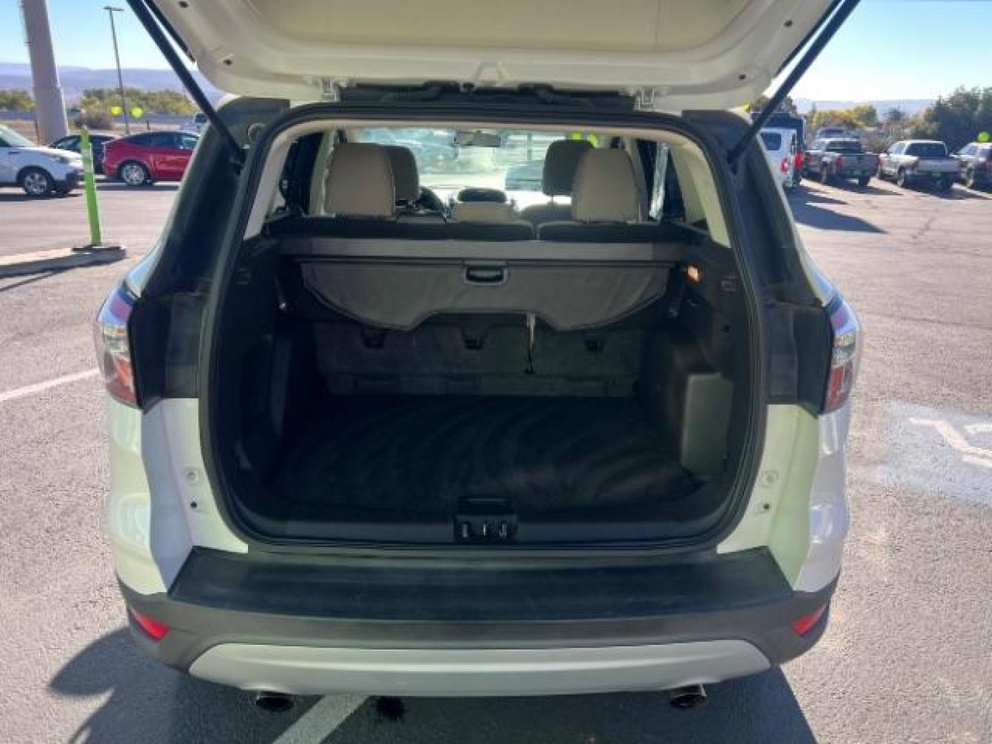 2017 Oxford White /Medium Light Stone Ford Escape SE (1FMCU0G91HU) with an EcoBoost 1.5L I-4 gasoline direct injection engine, Automatic transmission, located at 1865 East Red Hills Pkwy, St. George, 84770, (435) 628-0023, 37.120850, -113.543640 - We specialize in helping ALL people get the best financing available. No matter your credit score, good, bad or none we can get you an amazing rate. Had a bankruptcy, divorce, or repossessions? We give you the green light to get your credit back on the road. Low down and affordable payments that fit - Photo#24