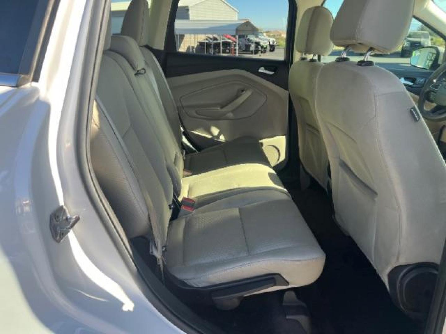 2017 Oxford White /Medium Light Stone Ford Escape SE (1FMCU0G91HU) with an EcoBoost 1.5L I-4 gasoline direct injection engine, Automatic transmission, located at 1865 East Red Hills Pkwy, St. George, 84770, (435) 628-0023, 37.120850, -113.543640 - We specialize in helping ALL people get the best financing available. No matter your credit score, good, bad or none we can get you an amazing rate. Had a bankruptcy, divorce, or repossessions? We give you the green light to get your credit back on the road. Low down and affordable payments that fit - Photo#27