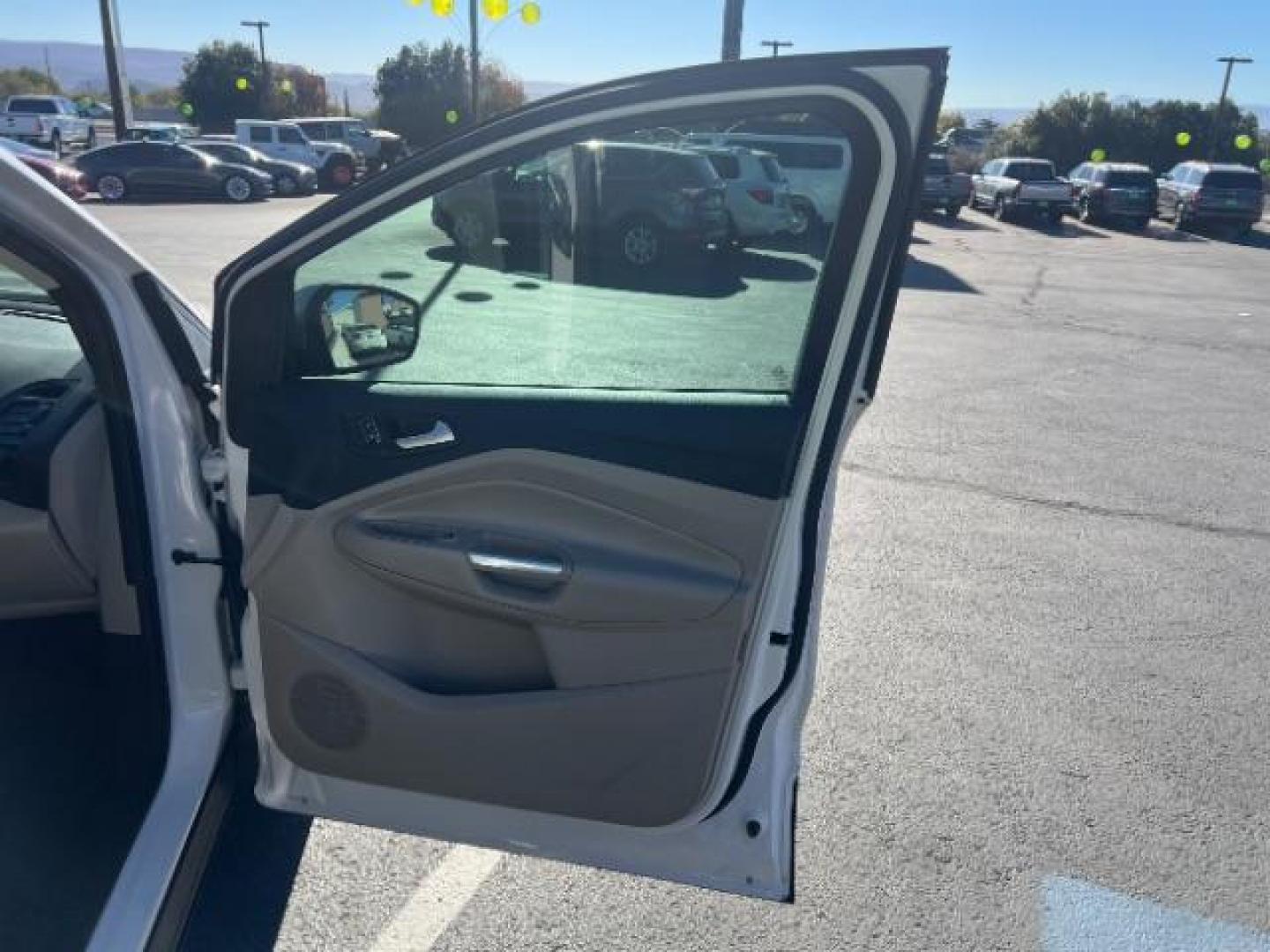 2017 Oxford White /Medium Light Stone Ford Escape SE (1FMCU0G91HU) with an EcoBoost 1.5L I-4 gasoline direct injection engine, Automatic transmission, located at 1865 East Red Hills Pkwy, St. George, 84770, (435) 628-0023, 37.120850, -113.543640 - We specialize in helping ALL people get the best financing available. No matter your credit score, good, bad or none we can get you an amazing rate. Had a bankruptcy, divorce, or repossessions? We give you the green light to get your credit back on the road. Low down and affordable payments that fit - Photo#28