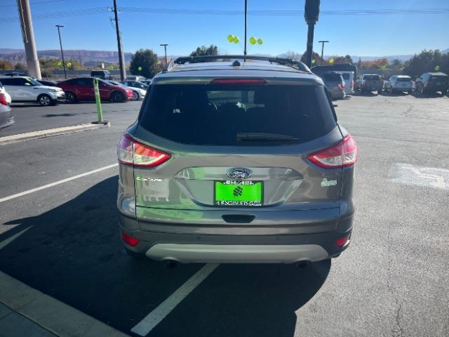 2014 Sterling Gray Metallic /Medium Light Stone Ford Escape SE (1FMCU9GX2EU) with an EcoBoost 1.6L I-4 gasoline direct injection engine, Automatic transmission, located at 940 North Main Street, Cedar City, UT, 84720, (435) 628-0023, 37.692936, -113.061897 - We specialize in helping ALL people get the best financing available. No matter your credit score, good, bad or none we can get you an amazing rate. Had a bankruptcy, divorce, or repossessions? We give you the green light to get your credit back on the road. Low down and affordable payments that fit - Photo#5