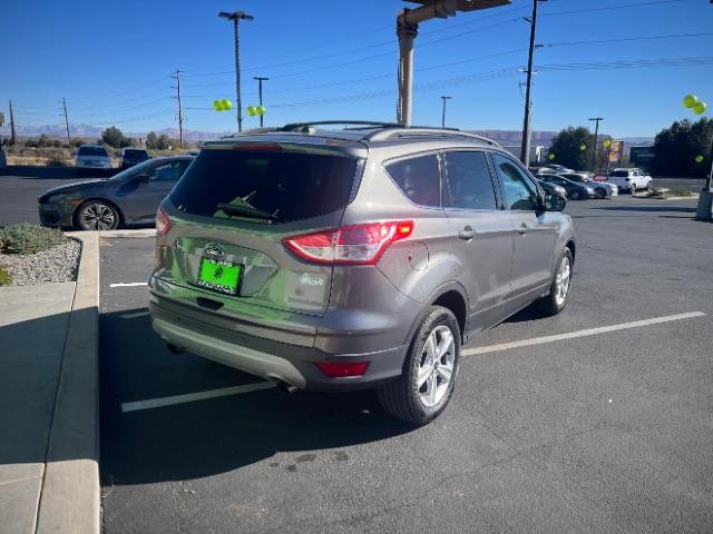 2014 Sterling Gray Metallic /Medium Light Stone Ford Escape SE (1FMCU9GX2EU) with an EcoBoost 1.6L I-4 gasoline direct injection engine, Automatic transmission, located at 1865 East Red Hills Pkwy, St. George, 84770, (435) 628-0023, 37.120850, -113.543640 - We specialize in helping ALL people get the best financing available. No matter your credit score, good, bad or none we can get you an amazing rate. Had a bankruptcy, divorce, or repossessions? We give you the green light to get your credit back on the road. Low down and affordable payments that fit - Photo#6