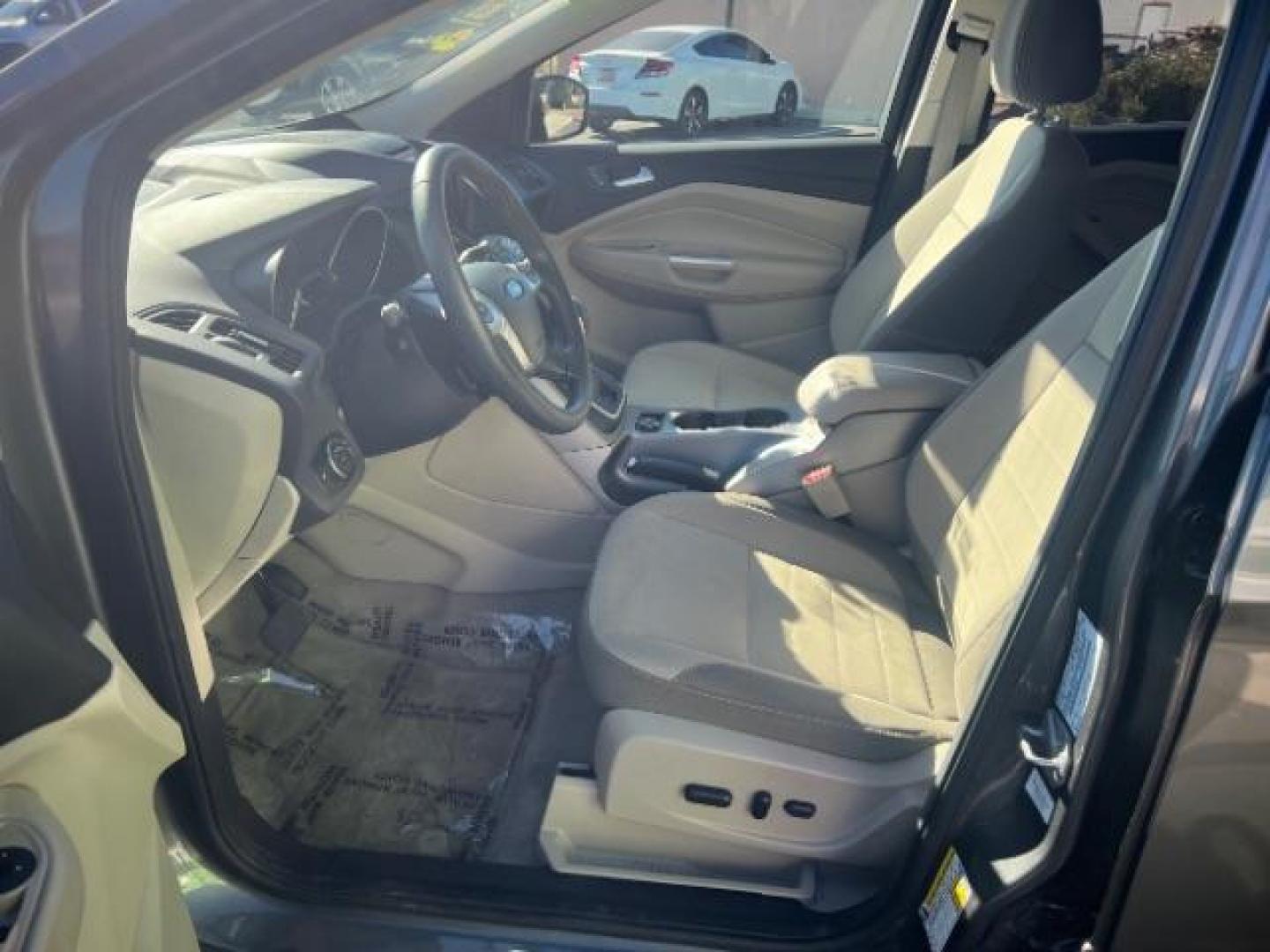 2014 Sterling Gray Metallic /Medium Light Stone Ford Escape SE (1FMCU9GX2EU) with an EcoBoost 1.6L I-4 gasoline direct injection engine, Automatic transmission, located at 1865 East Red Hills Pkwy, St. George, 84770, (435) 628-0023, 37.120850, -113.543640 - We specialize in helping ALL people get the best financing available. No matter your credit score, good, bad or none we can get you an amazing rate. Had a bankruptcy, divorce, or repossessions? We give you the green light to get your credit back on the road. Low down and affordable payments that fit - Photo#14