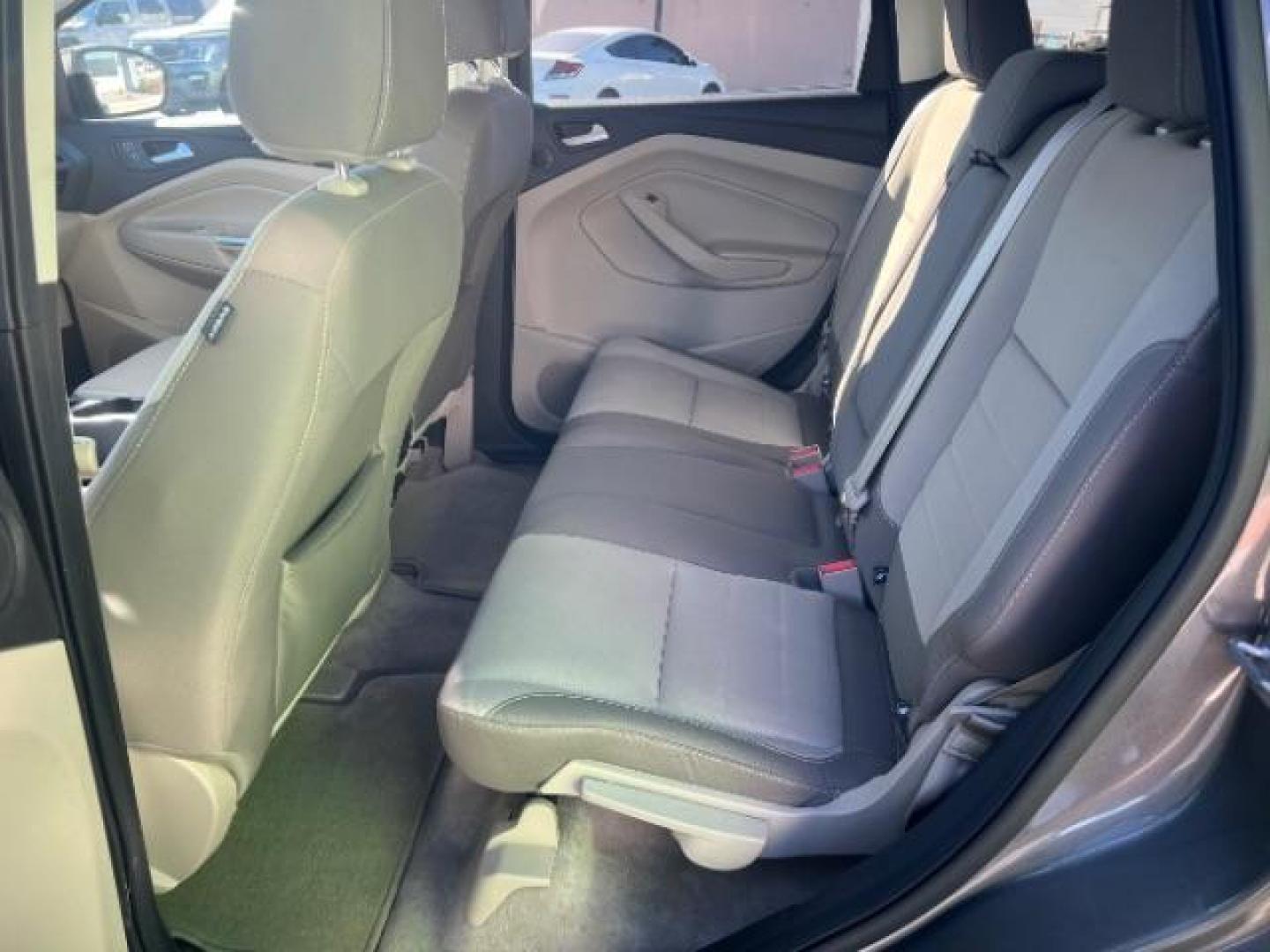 2014 Sterling Gray Metallic /Medium Light Stone Ford Escape SE (1FMCU9GX2EU) with an EcoBoost 1.6L I-4 gasoline direct injection engine, Automatic transmission, located at 1865 East Red Hills Pkwy, St. George, 84770, (435) 628-0023, 37.120850, -113.543640 - We specialize in helping ALL people get the best financing available. No matter your credit score, good, bad or none we can get you an amazing rate. Had a bankruptcy, divorce, or repossessions? We give you the green light to get your credit back on the road. Low down and affordable payments that fit - Photo#21