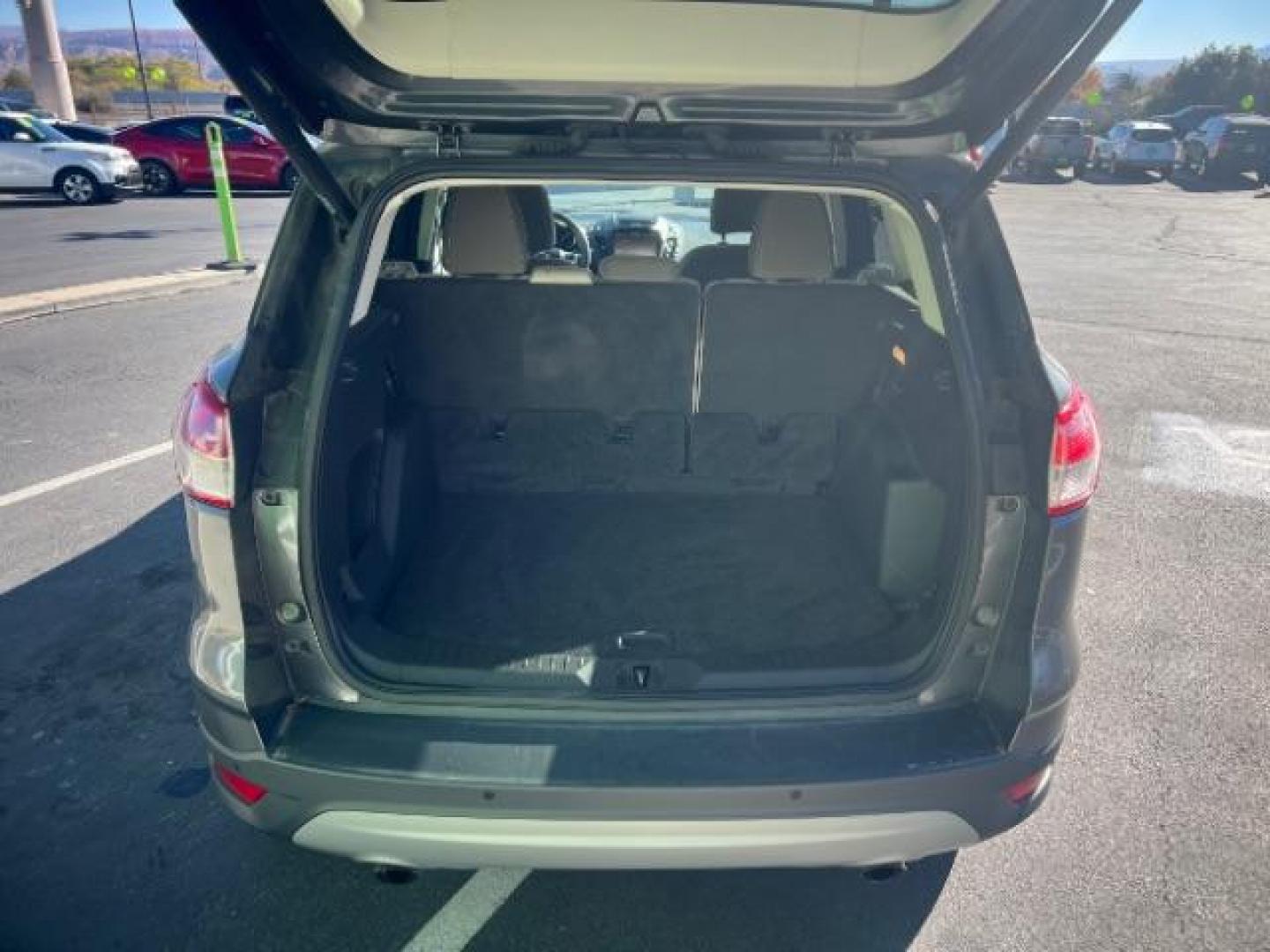 2014 Sterling Gray Metallic /Medium Light Stone Ford Escape SE (1FMCU9GX2EU) with an EcoBoost 1.6L I-4 gasoline direct injection engine, Automatic transmission, located at 1865 East Red Hills Pkwy, St. George, 84770, (435) 628-0023, 37.120850, -113.543640 - We specialize in helping ALL people get the best financing available. No matter your credit score, good, bad or none we can get you an amazing rate. Had a bankruptcy, divorce, or repossessions? We give you the green light to get your credit back on the road. Low down and affordable payments that fit - Photo#24