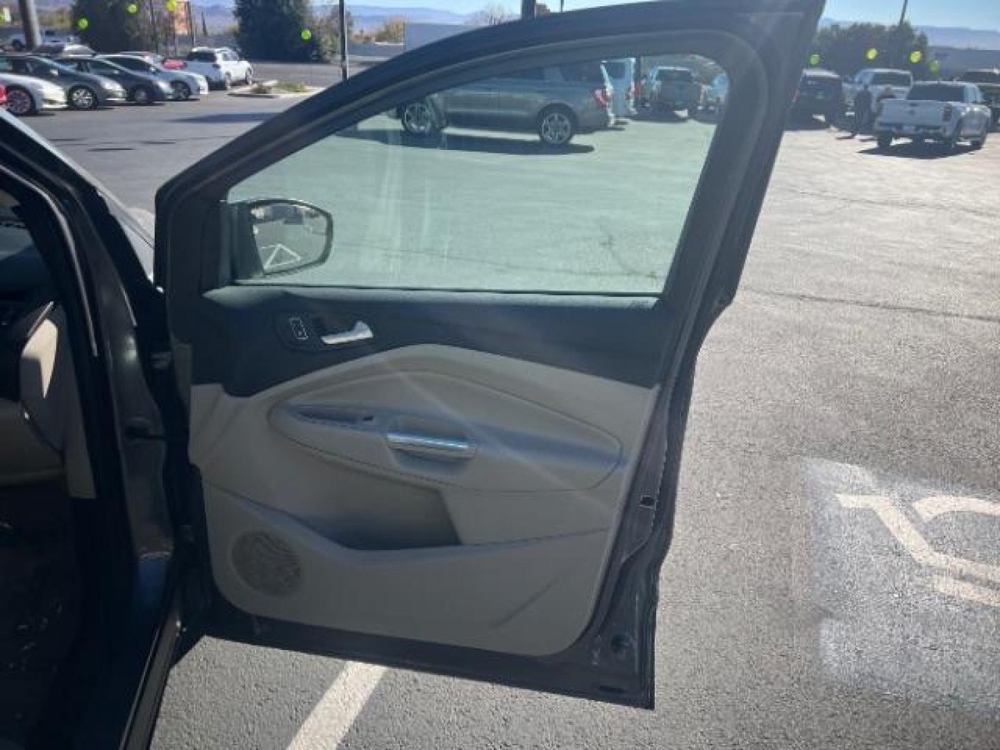 2014 Sterling Gray Metallic /Medium Light Stone Ford Escape SE (1FMCU9GX2EU) with an EcoBoost 1.6L I-4 gasoline direct injection engine, Automatic transmission, located at 1865 East Red Hills Pkwy, St. George, 84770, (435) 628-0023, 37.120850, -113.543640 - We specialize in helping ALL people get the best financing available. No matter your credit score, good, bad or none we can get you an amazing rate. Had a bankruptcy, divorce, or repossessions? We give you the green light to get your credit back on the road. Low down and affordable payments that fit - Photo#27