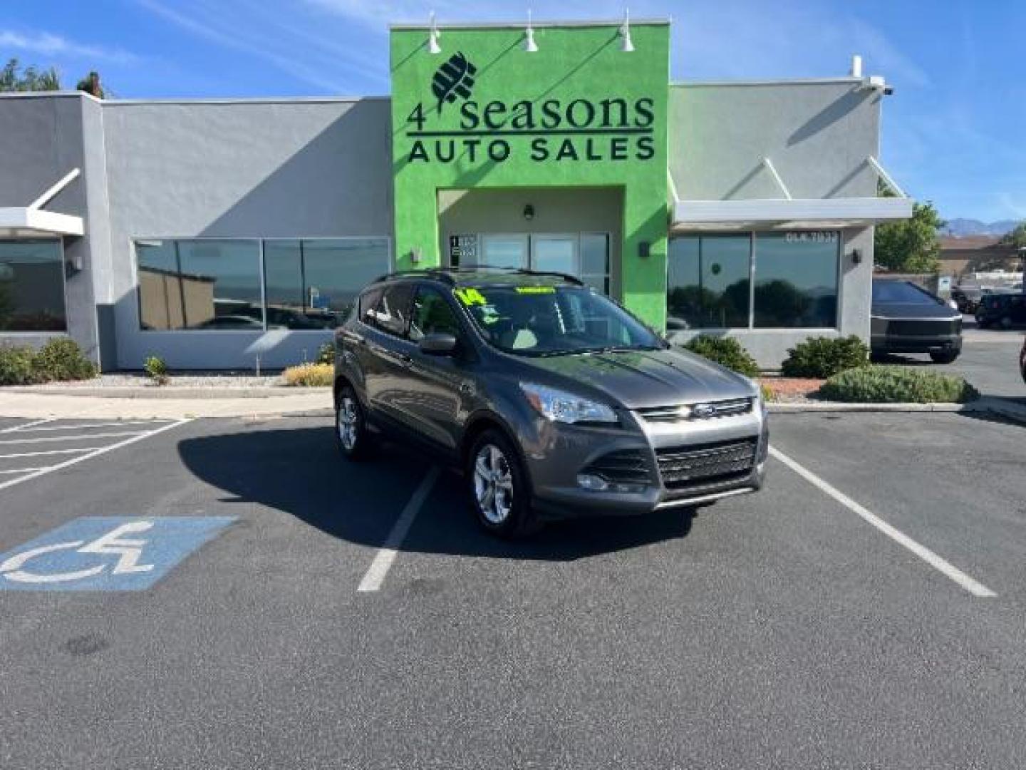 2014 Sterling Gray Metallic /Medium Light Stone Ford Escape SE (1FMCU9GX2EU) with an EcoBoost 1.6L I-4 gasoline direct injection engine, AUTOMATIC transmission, located at 940 North Main Street, Cedar City, UT, 84720, (435) 628-0023, 37.692936, -113.061897 - We specialize in helping ALL people get the best financing available. No matter your credit score, good, bad or none we can get you an amazing rate. Had a bankruptcy, divorce, or repossessions? We give you the green light to get your credit back on the road. Low down and affordable payments that fit- Photo#0