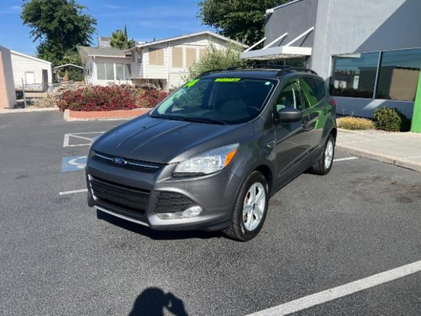 2014 Sterling Gray Metallic /Medium Light Stone Ford Escape SE (1FMCU9GX2EU) with an EcoBoost 1.6L I-4 gasoline direct injection engine, AUTOMATIC transmission, located at 940 North Main Street, Cedar City, UT, 84720, (435) 628-0023, 37.692936, -113.061897 - We specialize in helping ALL people get the best financing available. No matter your credit score, good, bad or none we can get you an amazing rate. Had a bankruptcy, divorce, or repossessions? We give you the green light to get your credit back on the road. Low down and affordable payments that fit- Photo#2