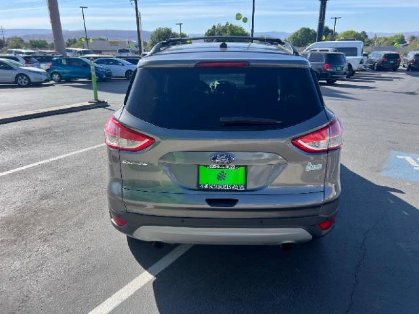 2014 Sterling Gray Metallic /Medium Light Stone Ford Escape SE (1FMCU9GX2EU) with an EcoBoost 1.6L I-4 gasoline direct injection engine, AUTOMATIC transmission, located at 940 North Main Street, Cedar City, UT, 84720, (435) 628-0023, 37.692936, -113.061897 - We specialize in helping ALL people get the best financing available. No matter your credit score, good, bad or none we can get you an amazing rate. Had a bankruptcy, divorce, or repossessions? We give you the green light to get your credit back on the road. Low down and affordable payments that fit- Photo#5
