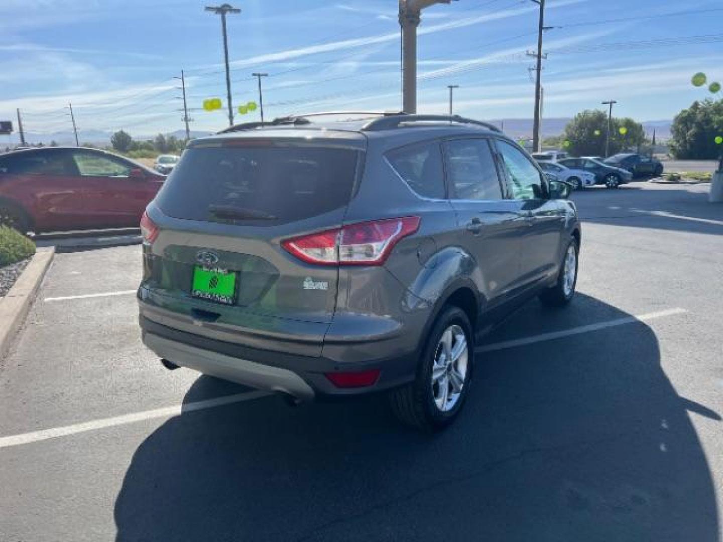 2014 Sterling Gray Metallic /Medium Light Stone Ford Escape SE (1FMCU9GX2EU) with an EcoBoost 1.6L I-4 gasoline direct injection engine, AUTOMATIC transmission, located at 940 North Main Street, Cedar City, UT, 84720, (435) 628-0023, 37.692936, -113.061897 - We specialize in helping ALL people get the best financing available. No matter your credit score, good, bad or none we can get you an amazing rate. Had a bankruptcy, divorce, or repossessions? We give you the green light to get your credit back on the road. Low down and affordable payments that fit- Photo#6