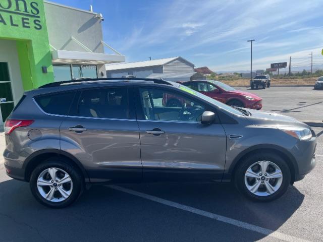 2014 Sterling Gray Metallic /Medium Light Stone Ford Escape SE (1FMCU9GX2EU) with an EcoBoost 1.6L I-4 gasoline direct injection engine, AUTOMATIC transmission, located at 1865 East Red Hills Pkwy, St. George, 84770, (435) 628-0023, 37.120850, -113.543640 - We specialize in helping ALL people get the best financing available. No matter your credit score, good, bad or none we can get you an amazing rate. Had a bankruptcy, divorce, or repossessions? We give you the green light to get your credit back on the road. Low down and affordable payments that fit - Photo#7