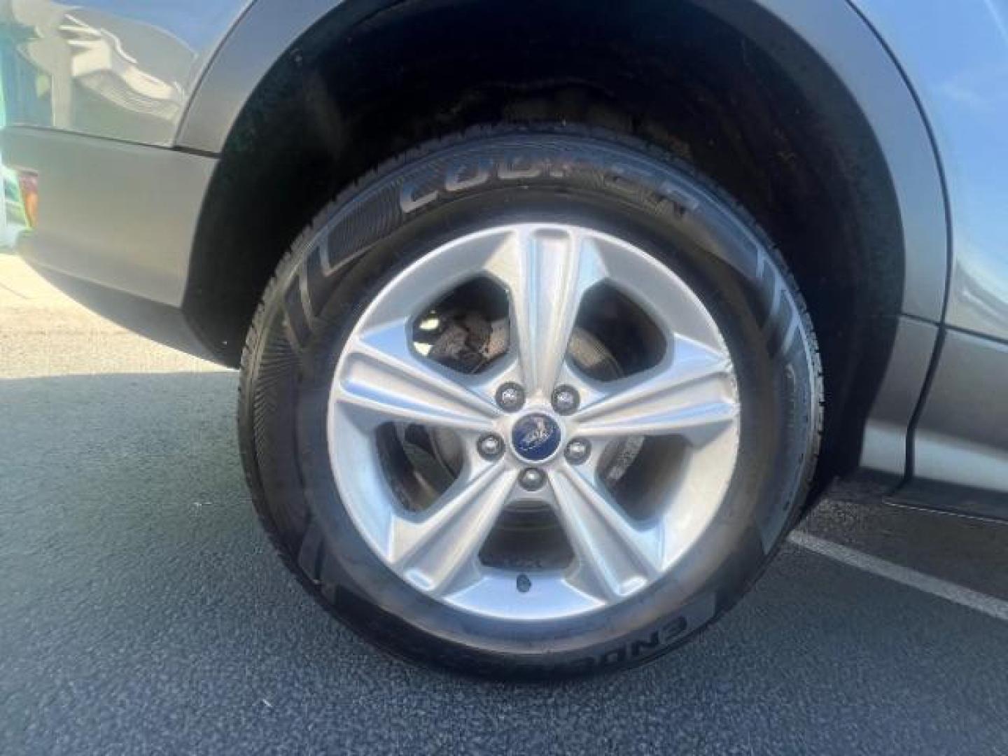 2014 Sterling Gray Metallic /Medium Light Stone Ford Escape SE (1FMCU9GX2EU) with an EcoBoost 1.6L I-4 gasoline direct injection engine, AUTOMATIC transmission, located at 940 North Main Street, Cedar City, UT, 84720, (435) 628-0023, 37.692936, -113.061897 - We specialize in helping ALL people get the best financing available. No matter your credit score, good, bad or none we can get you an amazing rate. Had a bankruptcy, divorce, or repossessions? We give you the green light to get your credit back on the road. Low down and affordable payments that fit- Photo#8
