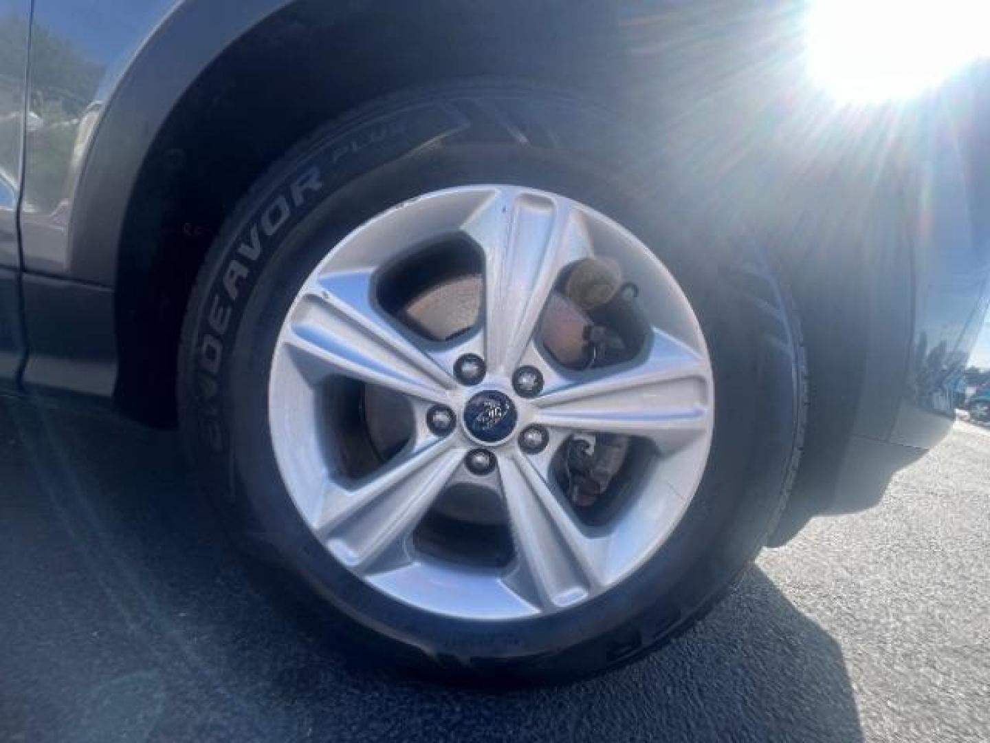 2014 Sterling Gray Metallic /Medium Light Stone Ford Escape SE (1FMCU9GX2EU) with an EcoBoost 1.6L I-4 gasoline direct injection engine, AUTOMATIC transmission, located at 940 North Main Street, Cedar City, UT, 84720, (435) 628-0023, 37.692936, -113.061897 - We specialize in helping ALL people get the best financing available. No matter your credit score, good, bad or none we can get you an amazing rate. Had a bankruptcy, divorce, or repossessions? We give you the green light to get your credit back on the road. Low down and affordable payments that fit- Photo#9