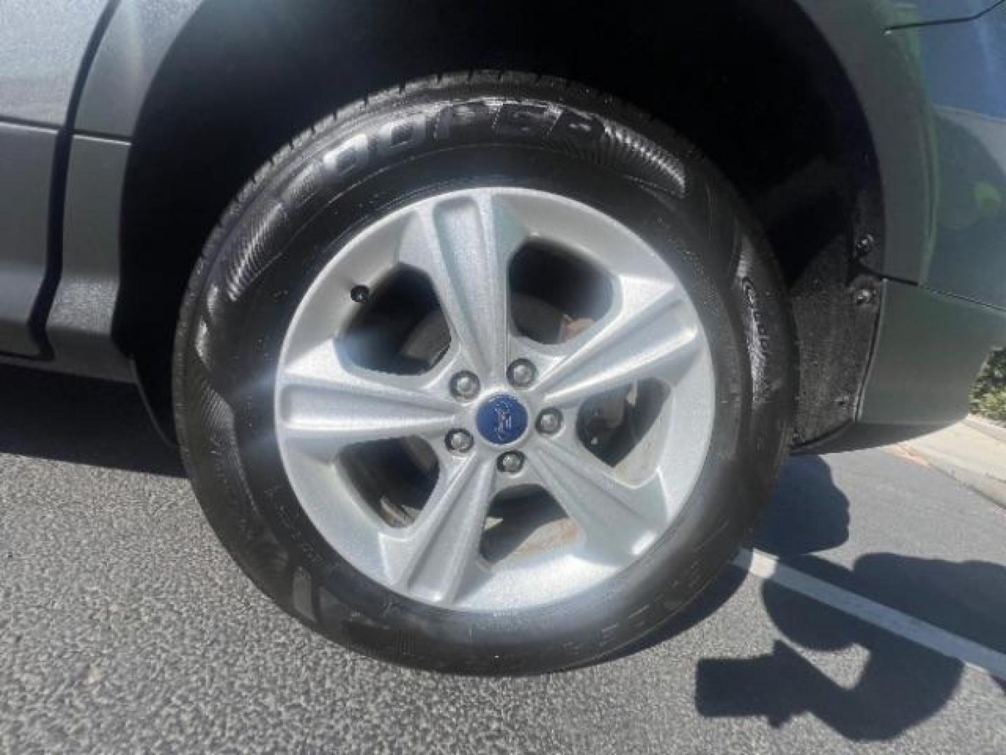 2014 Sterling Gray Metallic /Medium Light Stone Ford Escape SE (1FMCU9GX2EU) with an EcoBoost 1.6L I-4 gasoline direct injection engine, AUTOMATIC transmission, located at 940 North Main Street, Cedar City, UT, 84720, (435) 628-0023, 37.692936, -113.061897 - We specialize in helping ALL people get the best financing available. No matter your credit score, good, bad or none we can get you an amazing rate. Had a bankruptcy, divorce, or repossessions? We give you the green light to get your credit back on the road. Low down and affordable payments that fit- Photo#11