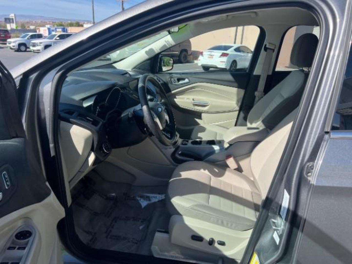 2014 Sterling Gray Metallic /Medium Light Stone Ford Escape SE (1FMCU9GX2EU) with an EcoBoost 1.6L I-4 gasoline direct injection engine, AUTOMATIC transmission, located at 940 North Main Street, Cedar City, UT, 84720, (435) 628-0023, 37.692936, -113.061897 - We specialize in helping ALL people get the best financing available. No matter your credit score, good, bad or none we can get you an amazing rate. Had a bankruptcy, divorce, or repossessions? We give you the green light to get your credit back on the road. Low down and affordable payments that fit- Photo#14