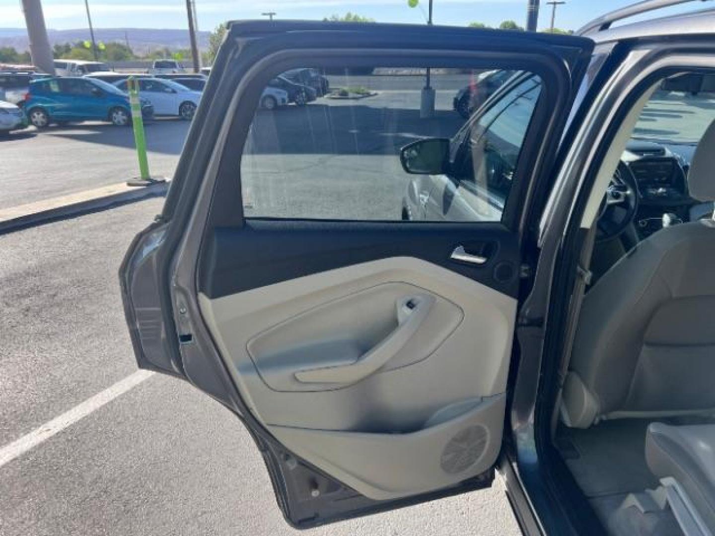 2014 Sterling Gray Metallic /Medium Light Stone Ford Escape SE (1FMCU9GX2EU) with an EcoBoost 1.6L I-4 gasoline direct injection engine, AUTOMATIC transmission, located at 940 North Main Street, Cedar City, UT, 84720, (435) 628-0023, 37.692936, -113.061897 - We specialize in helping ALL people get the best financing available. No matter your credit score, good, bad or none we can get you an amazing rate. Had a bankruptcy, divorce, or repossessions? We give you the green light to get your credit back on the road. Low down and affordable payments that fit- Photo#20