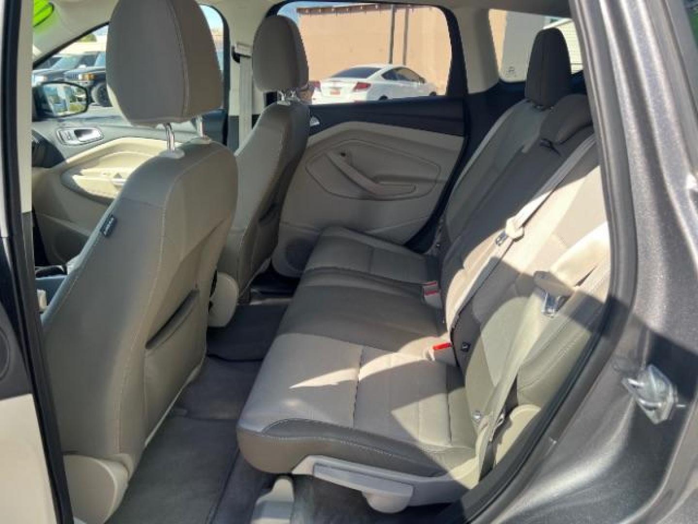 2014 Sterling Gray Metallic /Medium Light Stone Ford Escape SE (1FMCU9GX2EU) with an EcoBoost 1.6L I-4 gasoline direct injection engine, AUTOMATIC transmission, located at 940 North Main Street, Cedar City, UT, 84720, (435) 628-0023, 37.692936, -113.061897 - We specialize in helping ALL people get the best financing available. No matter your credit score, good, bad or none we can get you an amazing rate. Had a bankruptcy, divorce, or repossessions? We give you the green light to get your credit back on the road. Low down and affordable payments that fit- Photo#21