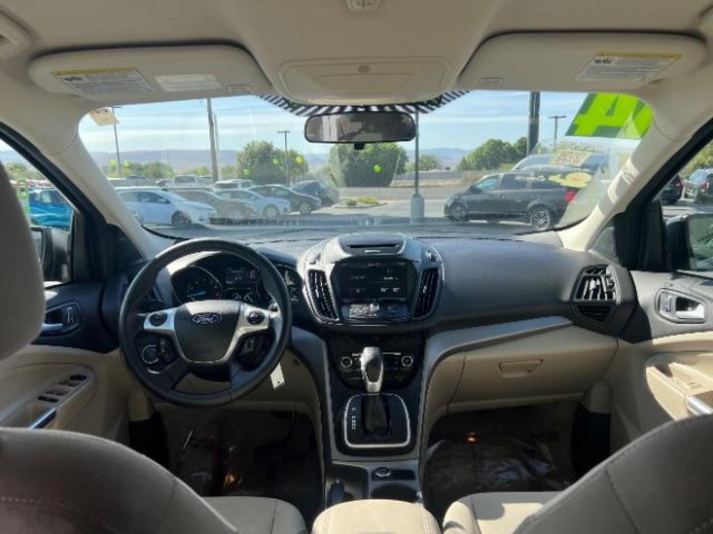 2014 Sterling Gray Metallic /Medium Light Stone Ford Escape SE (1FMCU9GX2EU) with an EcoBoost 1.6L I-4 gasoline direct injection engine, AUTOMATIC transmission, located at 940 North Main Street, Cedar City, UT, 84720, (435) 628-0023, 37.692936, -113.061897 - We specialize in helping ALL people get the best financing available. No matter your credit score, good, bad or none we can get you an amazing rate. Had a bankruptcy, divorce, or repossessions? We give you the green light to get your credit back on the road. Low down and affordable payments that fit- Photo#23