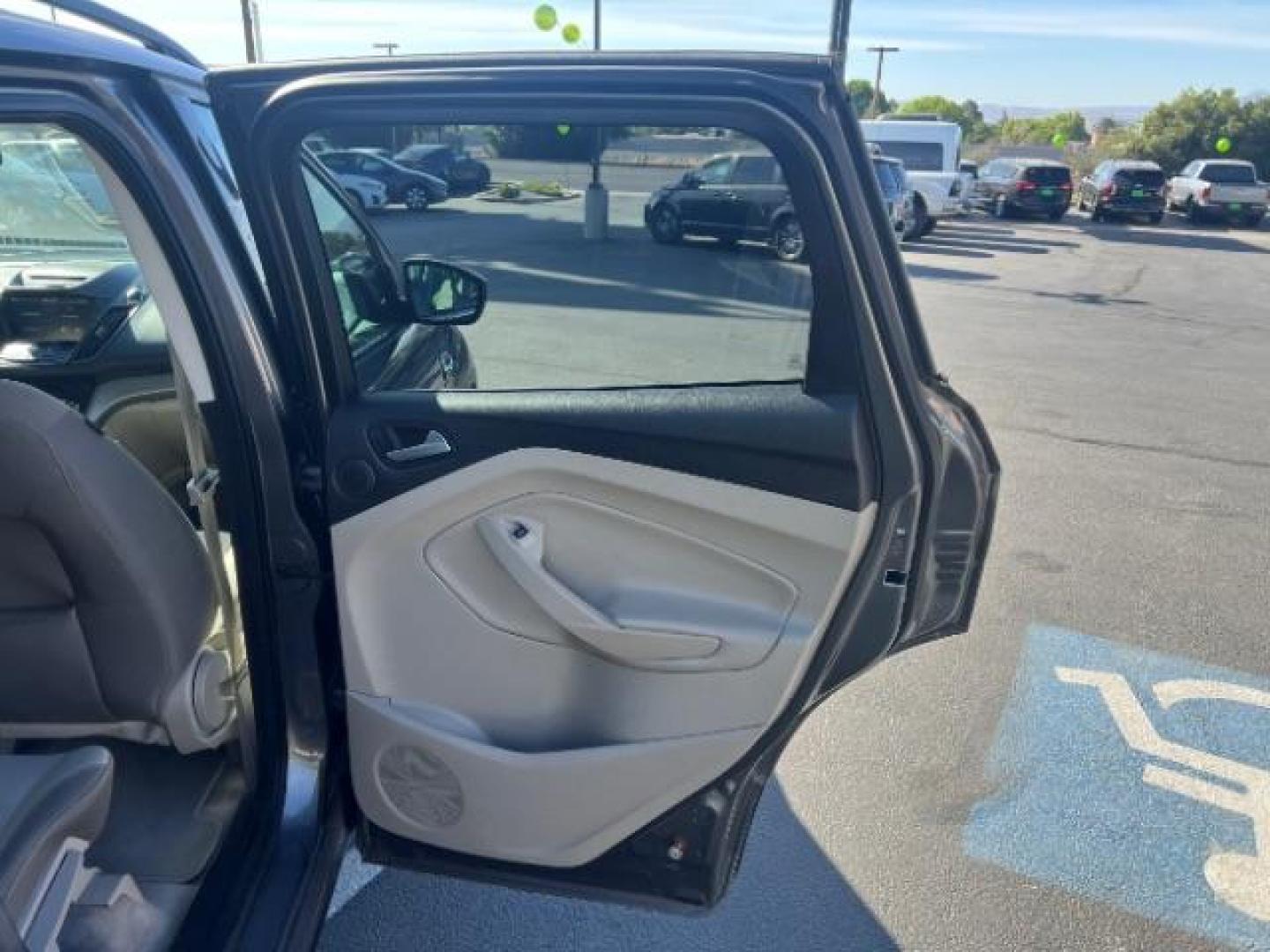 2014 Sterling Gray Metallic /Medium Light Stone Ford Escape SE (1FMCU9GX2EU) with an EcoBoost 1.6L I-4 gasoline direct injection engine, AUTOMATIC transmission, located at 940 North Main Street, Cedar City, UT, 84720, (435) 628-0023, 37.692936, -113.061897 - We specialize in helping ALL people get the best financing available. No matter your credit score, good, bad or none we can get you an amazing rate. Had a bankruptcy, divorce, or repossessions? We give you the green light to get your credit back on the road. Low down and affordable payments that fit- Photo#25