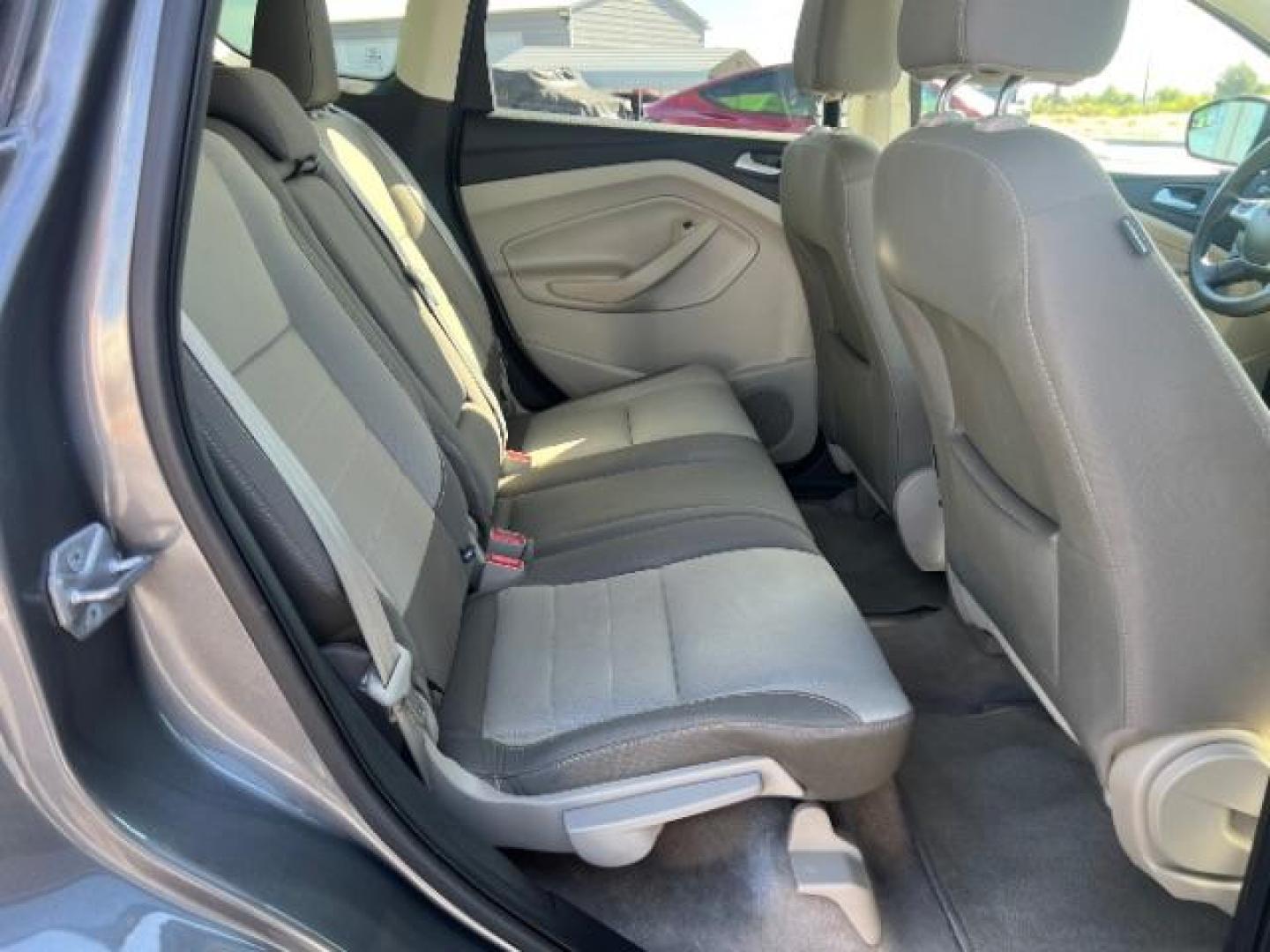 2014 Sterling Gray Metallic /Medium Light Stone Ford Escape SE (1FMCU9GX2EU) with an EcoBoost 1.6L I-4 gasoline direct injection engine, AUTOMATIC transmission, located at 940 North Main Street, Cedar City, UT, 84720, (435) 628-0023, 37.692936, -113.061897 - We specialize in helping ALL people get the best financing available. No matter your credit score, good, bad or none we can get you an amazing rate. Had a bankruptcy, divorce, or repossessions? We give you the green light to get your credit back on the road. Low down and affordable payments that fit- Photo#26