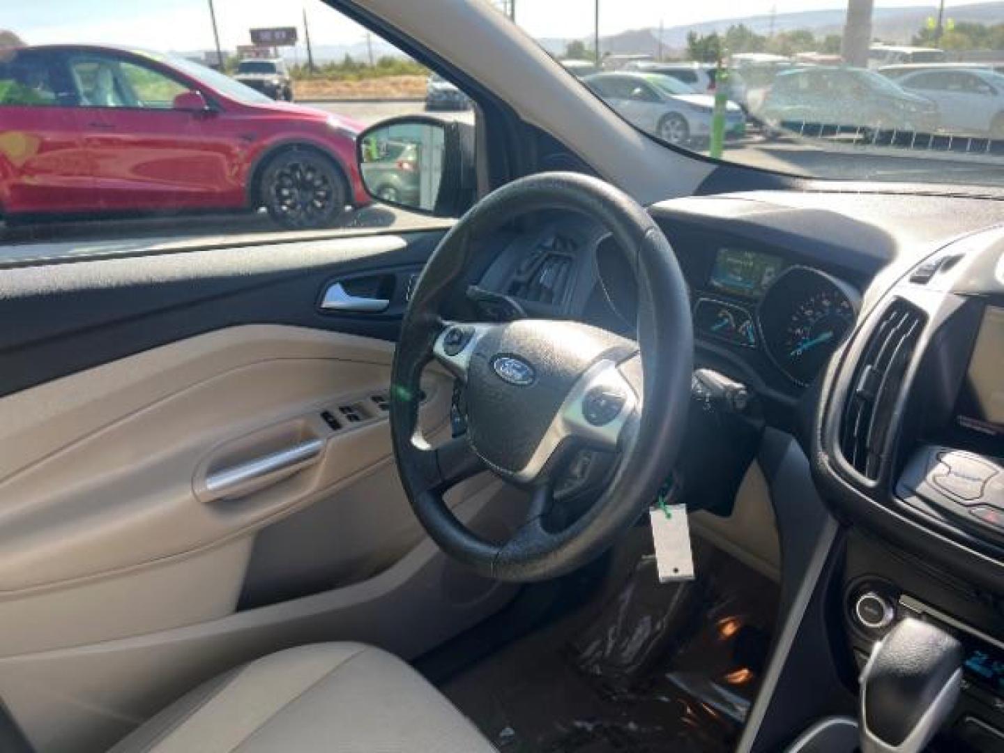 2014 Sterling Gray Metallic /Medium Light Stone Ford Escape SE (1FMCU9GX2EU) with an EcoBoost 1.6L I-4 gasoline direct injection engine, AUTOMATIC transmission, located at 940 North Main Street, Cedar City, UT, 84720, (435) 628-0023, 37.692936, -113.061897 - We specialize in helping ALL people get the best financing available. No matter your credit score, good, bad or none we can get you an amazing rate. Had a bankruptcy, divorce, or repossessions? We give you the green light to get your credit back on the road. Low down and affordable payments that fit- Photo#30