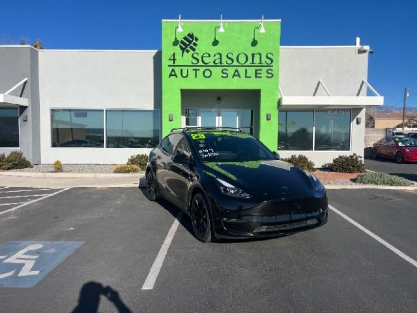 2023 Solid Black /Black Tesla Model Y Long Range Dual Motor All-Wheel Drive | AWD (7SAYGAEE8PF) with an ELECTRIC engine, Electric transmission, located at 1865 East Red Hills Pkwy, St. George, 84770, (435) 628-0023, 37.120850, -113.543640 - Blacked out Long Range AWD model Y with Hardware 4 AND 3rd row. Truly rare and hard to find. Hardware 4 is needed for latest FSD. Also has power roof shade, roof rack, trim, blacked out tail lights, new tires. Excellent condition. Battery charges to 300, Runs a drives perfect. Factory warranty on - Photo#0