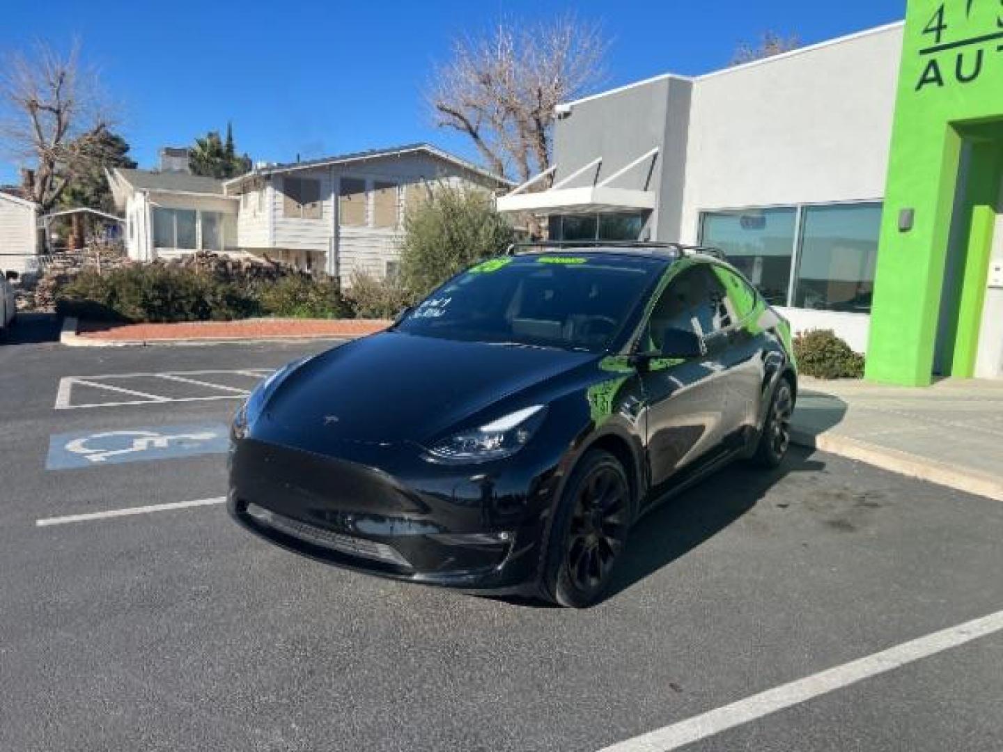 2023 Solid Black /Black Tesla Model Y Long Range Dual Motor All-Wheel Drive | AWD (7SAYGAEE8PF) with an ELECTRIC engine, Electric transmission, located at 1865 East Red Hills Pkwy, St. George, 84770, (435) 628-0023, 37.120850, -113.543640 - Blacked out Long Range AWD model Y with Hardware 4 AND 3rd row. Truly rare and hard to find. Hardware 4 is needed for latest FSD. Also has power roof shade, roof rack, trim, blacked out tail lights, new tires. Excellent condition. Battery charges to 300, Runs a drives perfect. Factory warranty on - Photo#4