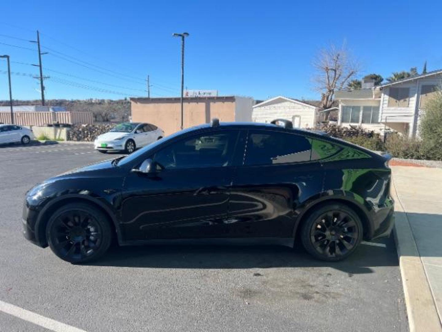 2023 Solid Black /Black Tesla Model Y Long Range Dual Motor All-Wheel Drive | AWD (7SAYGAEE8PF) with an ELECTRIC engine, Electric transmission, located at 1865 East Red Hills Pkwy, St. George, 84770, (435) 628-0023, 37.120850, -113.543640 - Blacked out Long Range AWD model Y with Hardware 4 AND 3rd row. Truly rare and hard to find. Hardware 4 is needed for latest FSD. Also has power roof shade, roof rack, trim, blacked out tail lights, new tires. Excellent condition. Battery charges to 300, Runs a drives perfect. Factory warranty on - Photo#5