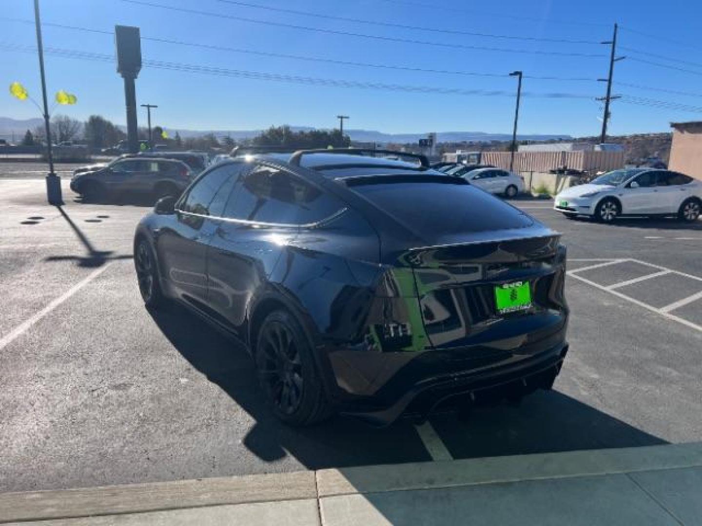 2023 Solid Black /Black Tesla Model Y Long Range Dual Motor All-Wheel Drive | AWD (7SAYGAEE8PF) with an ELECTRIC engine, Electric transmission, located at 1865 East Red Hills Pkwy, St. George, 84770, (435) 628-0023, 37.120850, -113.543640 - Blacked out Long Range AWD model Y with Hardware 4 AND 3rd row. Truly rare and hard to find. Hardware 4 is needed for latest FSD. Also has power roof shade, roof rack, trim, blacked out tail lights, new tires. Excellent condition. Battery charges to 300, Runs a drives perfect. Factory warranty on - Photo#6