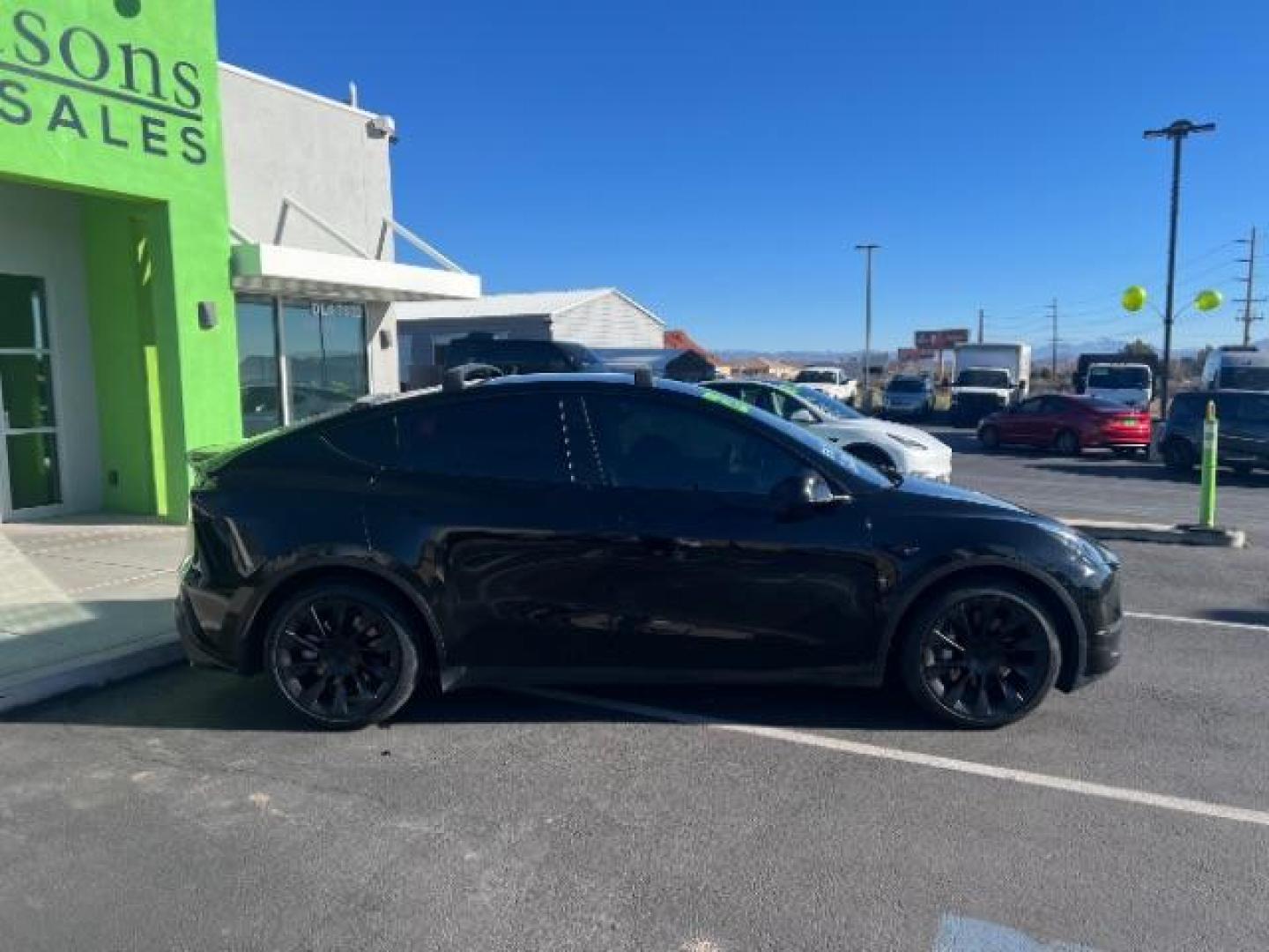 2023 Solid Black /Black Tesla Model Y Long Range Dual Motor All-Wheel Drive | AWD (7SAYGAEE8PF) with an ELECTRIC engine, Electric transmission, located at 1865 East Red Hills Pkwy, St. George, 84770, (435) 628-0023, 37.120850, -113.543640 - Blacked out Long Range AWD model Y with Hardware 4 AND 3rd row. Truly rare and hard to find. Hardware 4 is needed for latest FSD. Also has power roof shade, roof rack, trim, blacked out tail lights, new tires. Excellent condition. Battery charges to 300, Runs a drives perfect. Factory warranty on - Photo#9