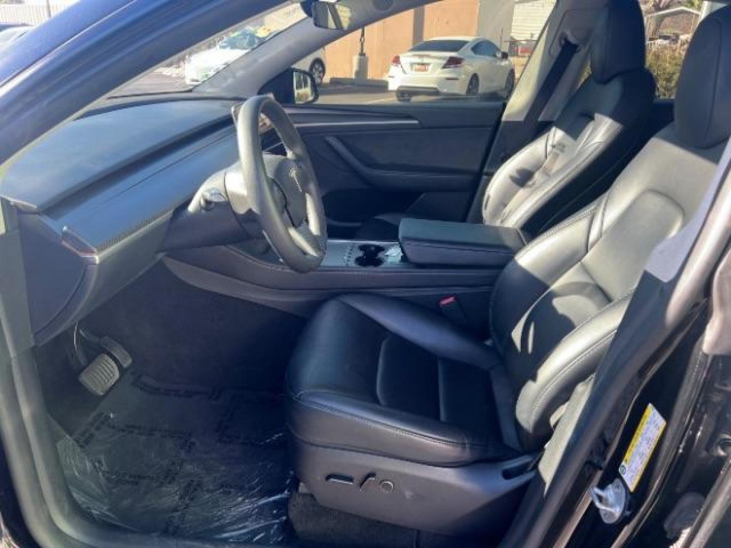 2023 Solid Black /Black Tesla Model Y Long Range Dual Motor All-Wheel Drive | AWD (7SAYGAEE8PF) with an ELECTRIC engine, Electric transmission, located at 1865 East Red Hills Pkwy, St. George, 84770, (435) 628-0023, 37.120850, -113.543640 - Blacked out Long Range AWD model Y with Hardware 4 AND 3rd row. Truly rare and hard to find. Hardware 4 is needed for latest FSD. Also has power roof shade, roof rack, trim, blacked out tail lights, new tires. Excellent condition. Battery charges to 300, Runs a drives perfect. Factory warranty on - Photo#16