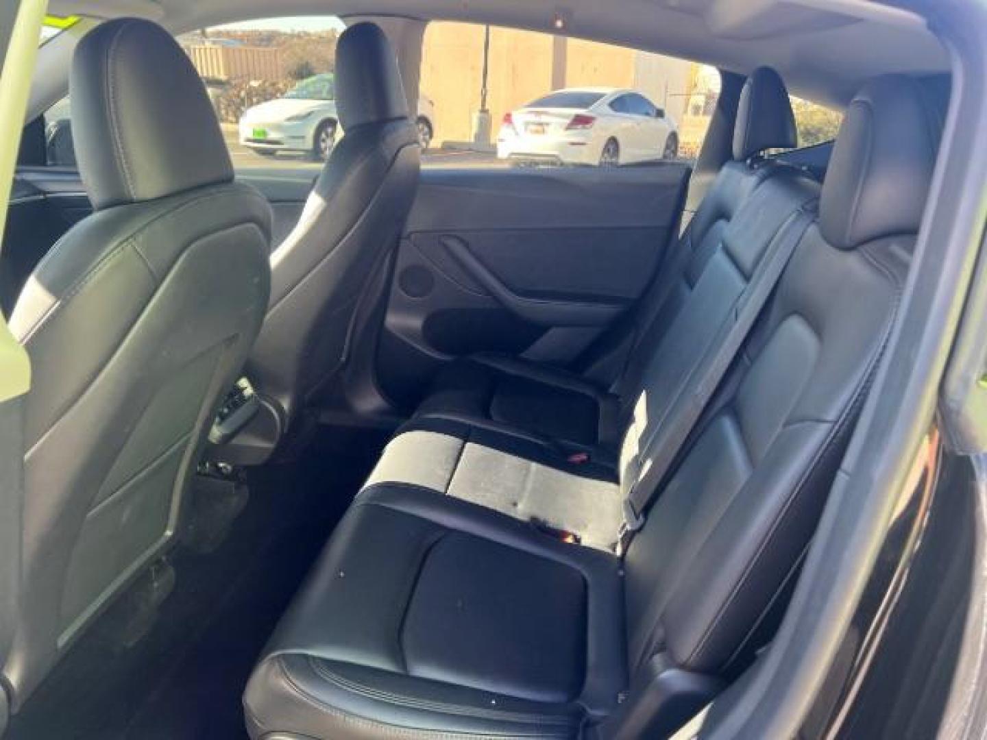 2023 Solid Black /Black Tesla Model Y Long Range Dual Motor All-Wheel Drive | AWD (7SAYGAEE8PF) with an ELECTRIC engine, Electric transmission, located at 1865 East Red Hills Pkwy, St. George, 84770, (435) 628-0023, 37.120850, -113.543640 - Blacked out Long Range AWD model Y with Hardware 4 AND 3rd row. Truly rare and hard to find. Hardware 4 is needed for latest FSD. Also has power roof shade, roof rack, trim, blacked out tail lights, new tires. Excellent condition. Battery charges to 300, Runs a drives perfect. Factory warranty on - Photo#21