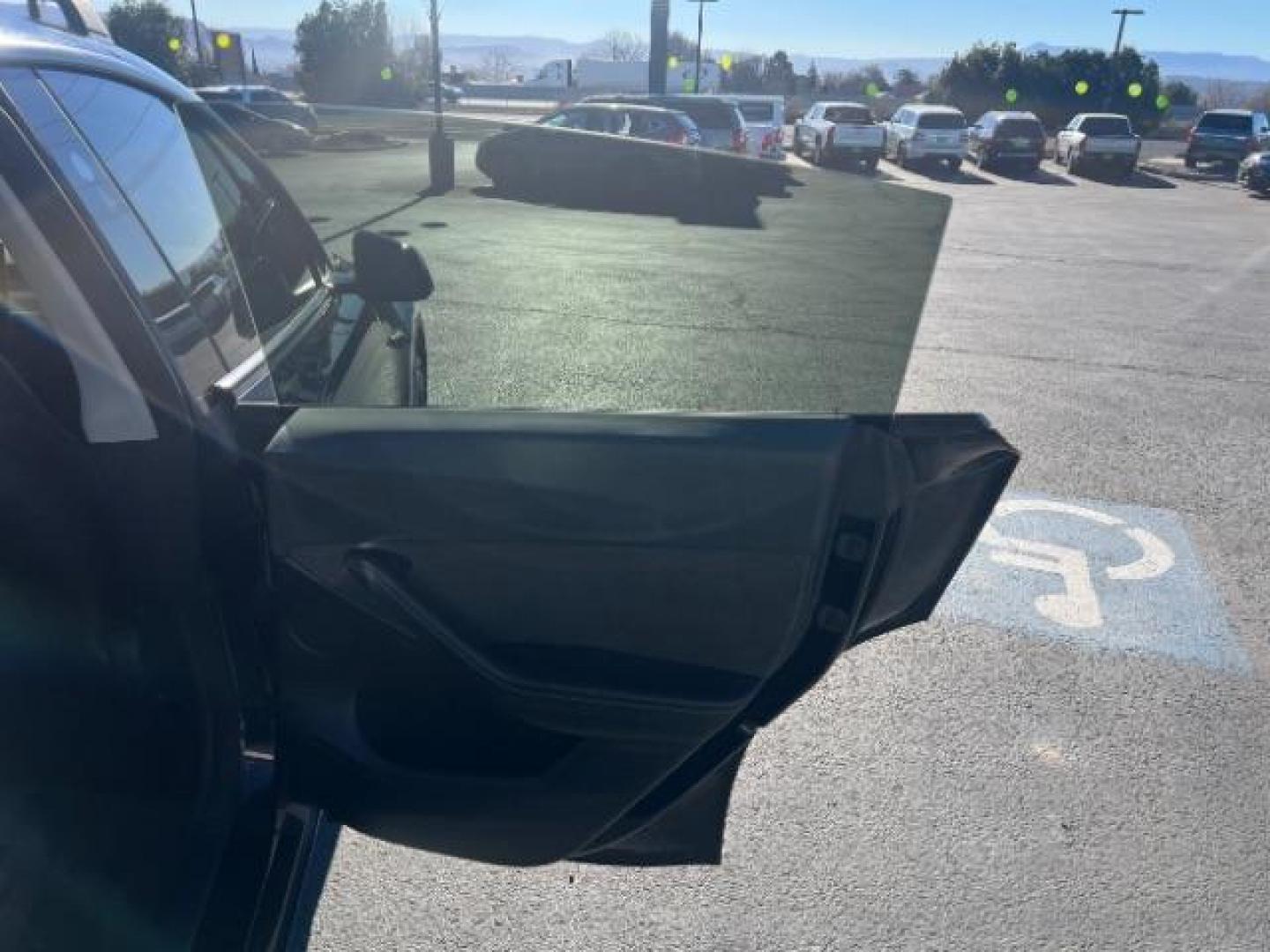2023 Solid Black /Black Tesla Model Y Long Range Dual Motor All-Wheel Drive | AWD (7SAYGAEE8PF) with an ELECTRIC engine, Electric transmission, located at 1865 East Red Hills Pkwy, St. George, 84770, (435) 628-0023, 37.120850, -113.543640 - Blacked out Long Range AWD model Y with Hardware 4 AND 3rd row. Truly rare and hard to find. Hardware 4 is needed for latest FSD. Also has power roof shade, roof rack, trim, blacked out tail lights, new tires. Excellent condition. Battery charges to 300, Runs a drives perfect. Factory warranty on - Photo#28