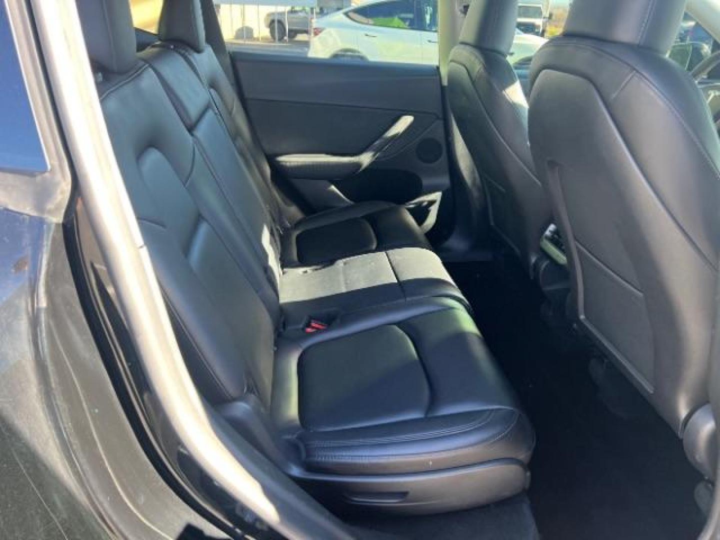 2023 Solid Black /Black Tesla Model Y Long Range Dual Motor All-Wheel Drive | AWD (7SAYGAEE8PF) with an ELECTRIC engine, Electric transmission, located at 1865 East Red Hills Pkwy, St. George, 84770, (435) 628-0023, 37.120850, -113.543640 - Blacked out Long Range AWD model Y with Hardware 4 AND 3rd row. Truly rare and hard to find. Hardware 4 is needed for latest FSD. Also has power roof shade, roof rack, trim, blacked out tail lights, new tires. Excellent condition. Battery charges to 300, Runs a drives perfect. Factory warranty on - Photo#29