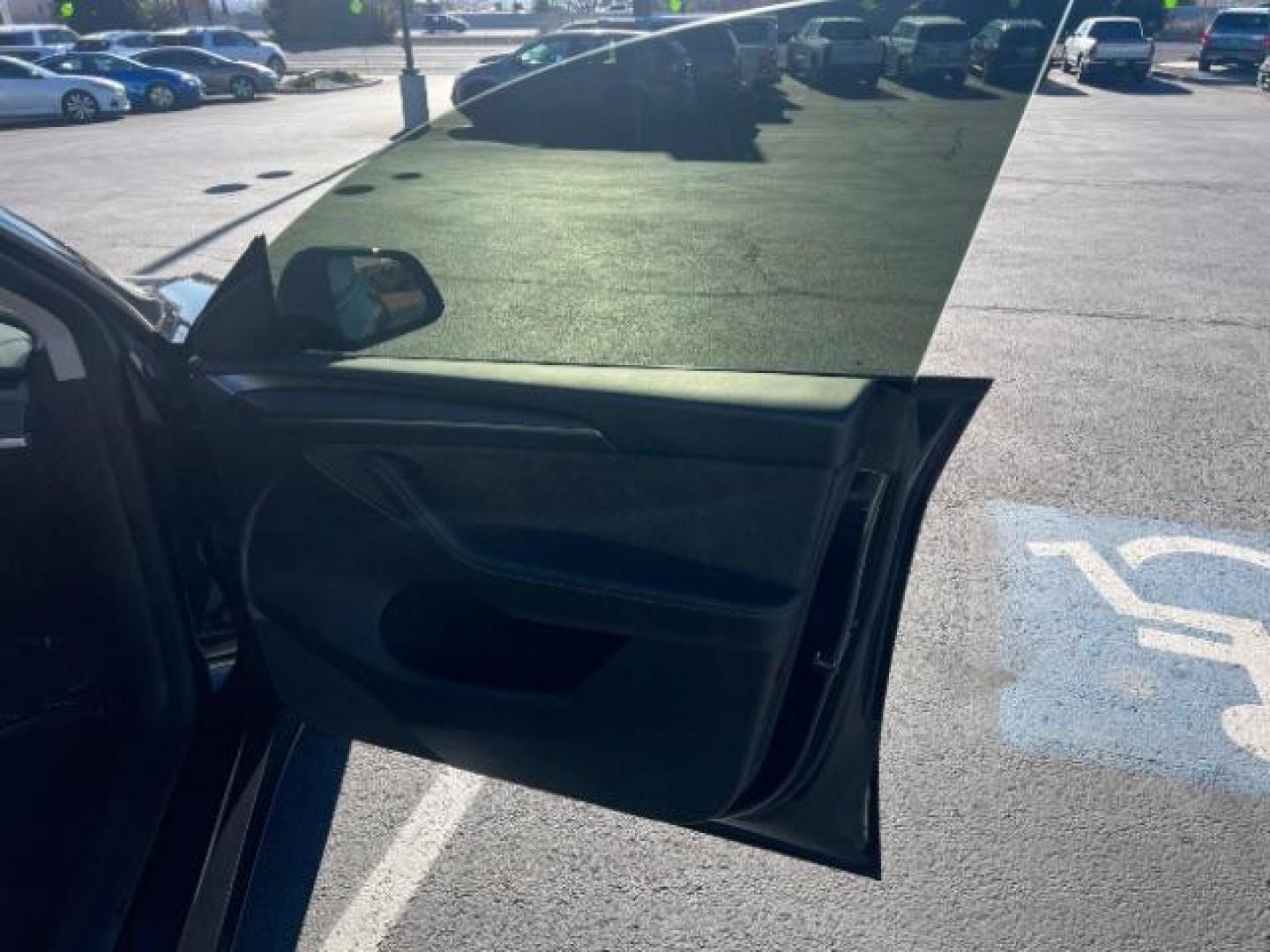 2023 Solid Black /Black Tesla Model Y Long Range Dual Motor All-Wheel Drive | AWD (7SAYGAEE8PF) with an ELECTRIC engine, Electric transmission, located at 1865 East Red Hills Pkwy, St. George, 84770, (435) 628-0023, 37.120850, -113.543640 - Blacked out Long Range AWD model Y with Hardware 4 AND 3rd row. Truly rare and hard to find. Hardware 4 is needed for latest FSD. Also has power roof shade, roof rack, trim, blacked out tail lights, new tires. Excellent condition. Battery charges to 300, Runs a drives perfect. Factory warranty on - Photo#30