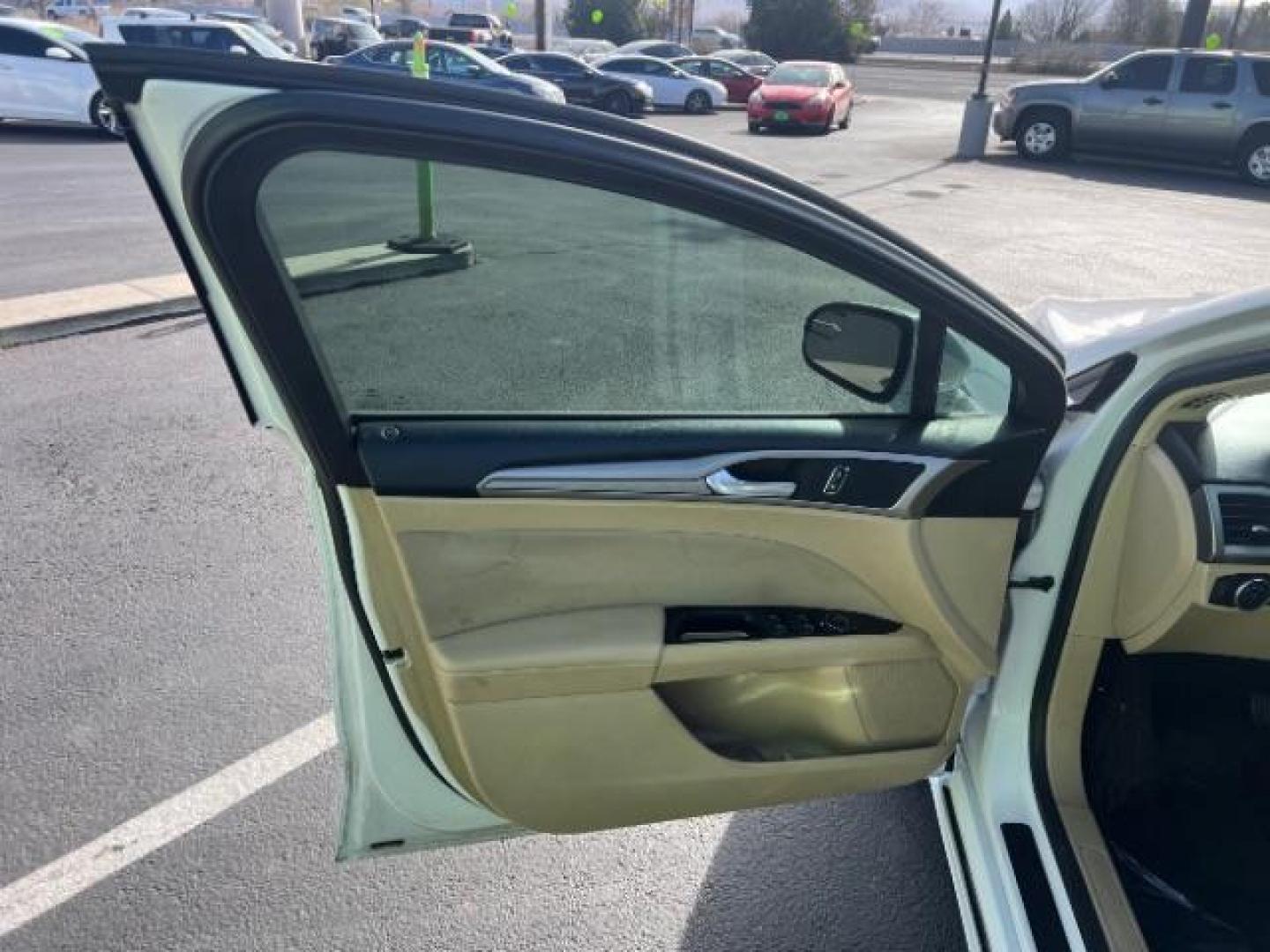 2016 Oxford White /Dune Ford Fusion SE (3FA6P0H79GR) with an Duratec 2.5L I-4 DOHC engine, Automatic transmission, located at 1865 East Red Hills Pkwy, St. George, 84770, (435) 628-0023, 37.120850, -113.543640 - We specialize in helping ALL people get the best financing available. No matter your credit score, good, bad or none we can get you an amazing rate. Had a bankruptcy, divorce, or repossessions? We give you the green light to get your credit back on the road. Low down and affordable payments that fit - Photo#12