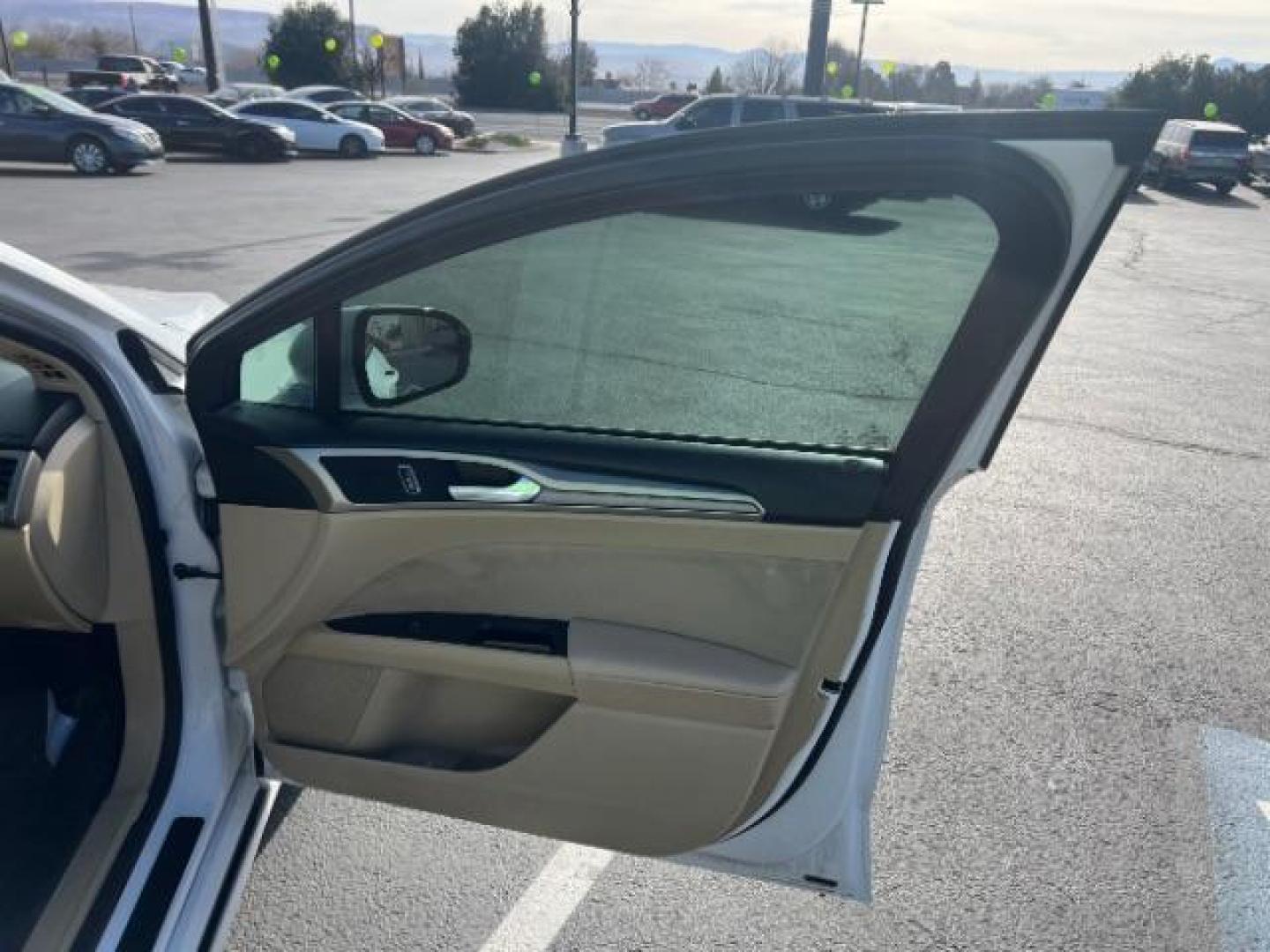 2016 Oxford White /Dune Ford Fusion SE (3FA6P0H79GR) with an Duratec 2.5L I-4 DOHC engine, Automatic transmission, located at 1865 East Red Hills Pkwy, St. George, 84770, (435) 628-0023, 37.120850, -113.543640 - We specialize in helping ALL people get the best financing available. No matter your credit score, good, bad or none we can get you an amazing rate. Had a bankruptcy, divorce, or repossessions? We give you the green light to get your credit back on the road. Low down and affordable payments that fit - Photo#27