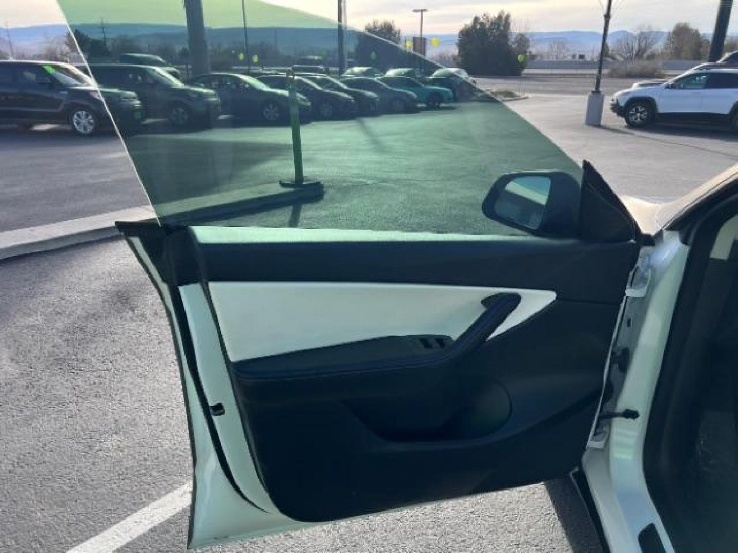2021 White /White/Black Tesla Model Y Long Range Dual Motor All-Wheel Drive (5YJYGDEE5MF) with an ELECTRIC engine, Electric transmission, located at 1865 East Red Hills Pkwy, St. George, 84770, (435) 628-0023, 37.120850, -113.543640 - Excellent Tesla Model Y Long Range All Wheel Drive. With Full Self Drive paid for ($8k add on) Which is no longer available to buy. All our Teslas come with charging kit. Color changing wrap is a little rough but will still turn heads. Battery is healthy. Gets 275 on full charge. Clean title, no a - Photo#14