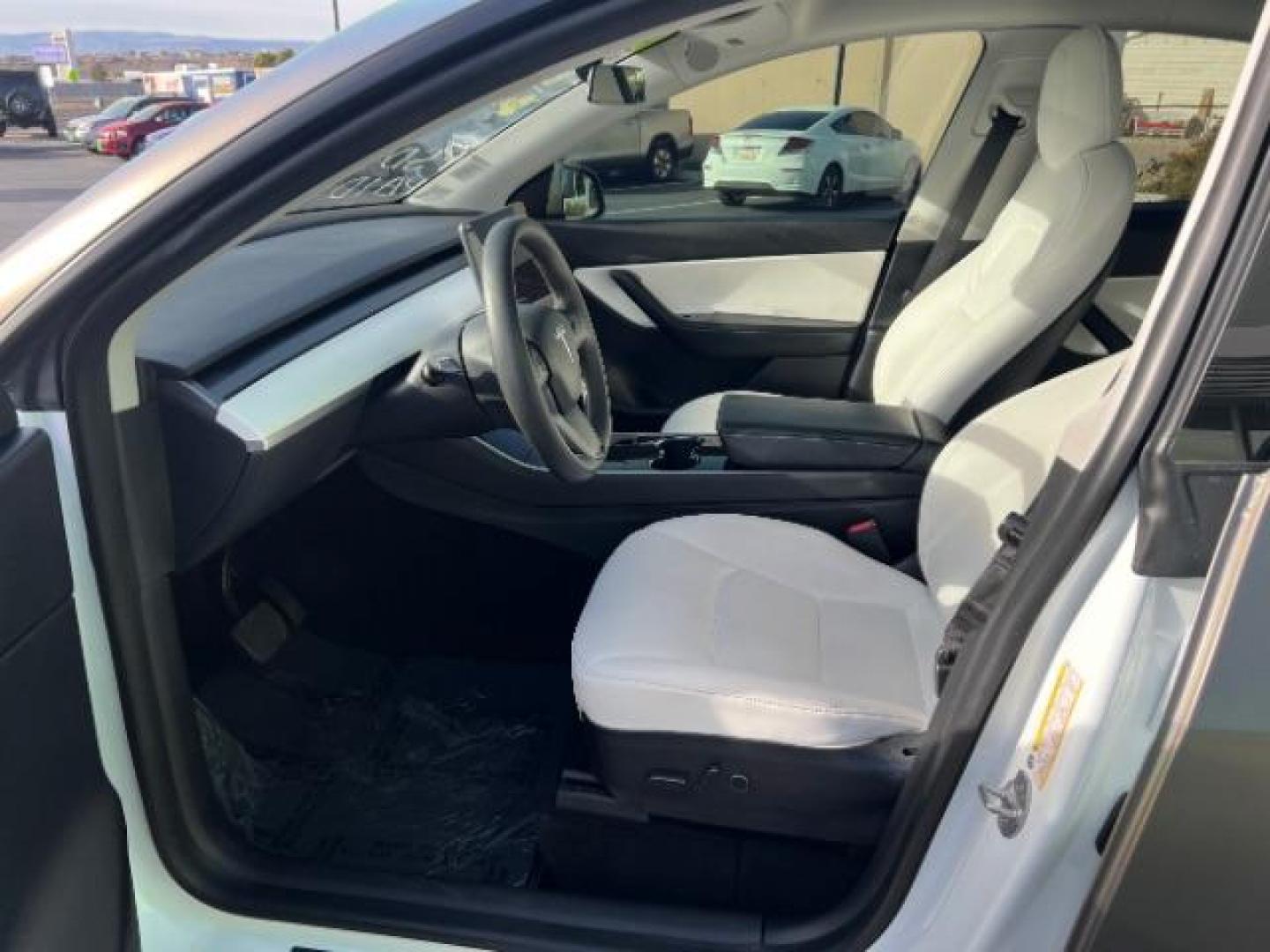 2021 White /White/Black Tesla Model Y Long Range Dual Motor All-Wheel Drive (5YJYGDEE5MF) with an ELECTRIC engine, Electric transmission, located at 1865 East Red Hills Pkwy, St. George, 84770, (435) 628-0023, 37.120850, -113.543640 - Excellent Tesla Model Y Long Range All Wheel Drive. With Full Self Drive paid for ($8k add on) Which is no longer available to buy. All our Teslas come with charging kit. Color changing wrap is a little rough but will still turn heads. Battery is healthy. Gets 275 on full charge. Clean title, no a - Photo#16