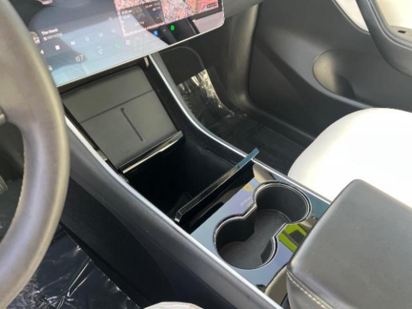 2021 White /White/Black Tesla Model Y Long Range Dual Motor All-Wheel Drive (5YJYGDEE5MF) with an ELECTRIC engine, Electric transmission, located at 1865 East Red Hills Pkwy, St. George, 84770, (435) 628-0023, 37.120850, -113.543640 - Excellent Tesla Model Y Long Range All Wheel Drive. With Full Self Drive paid for ($8k add on) Which is no longer available to buy. All our Teslas come with charging kit. Color changing wrap is a little rough but will still turn heads. Battery is healthy. Gets 275 on full charge. Clean title, no a - Photo#18