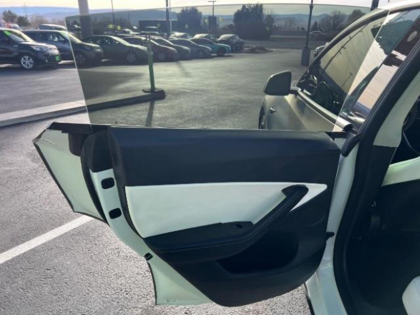 2021 White /White/Black Tesla Model Y Long Range Dual Motor All-Wheel Drive (5YJYGDEE5MF) with an ELECTRIC engine, Electric transmission, located at 1865 East Red Hills Pkwy, St. George, 84770, (435) 628-0023, 37.120850, -113.543640 - Excellent Tesla Model Y Long Range All Wheel Drive. With Full Self Drive paid for ($8k add on) Which is no longer available to buy. All our Teslas come with charging kit. Color changing wrap is a little rough but will still turn heads. Battery is healthy. Gets 275 on full charge. Clean title, no a - Photo#20