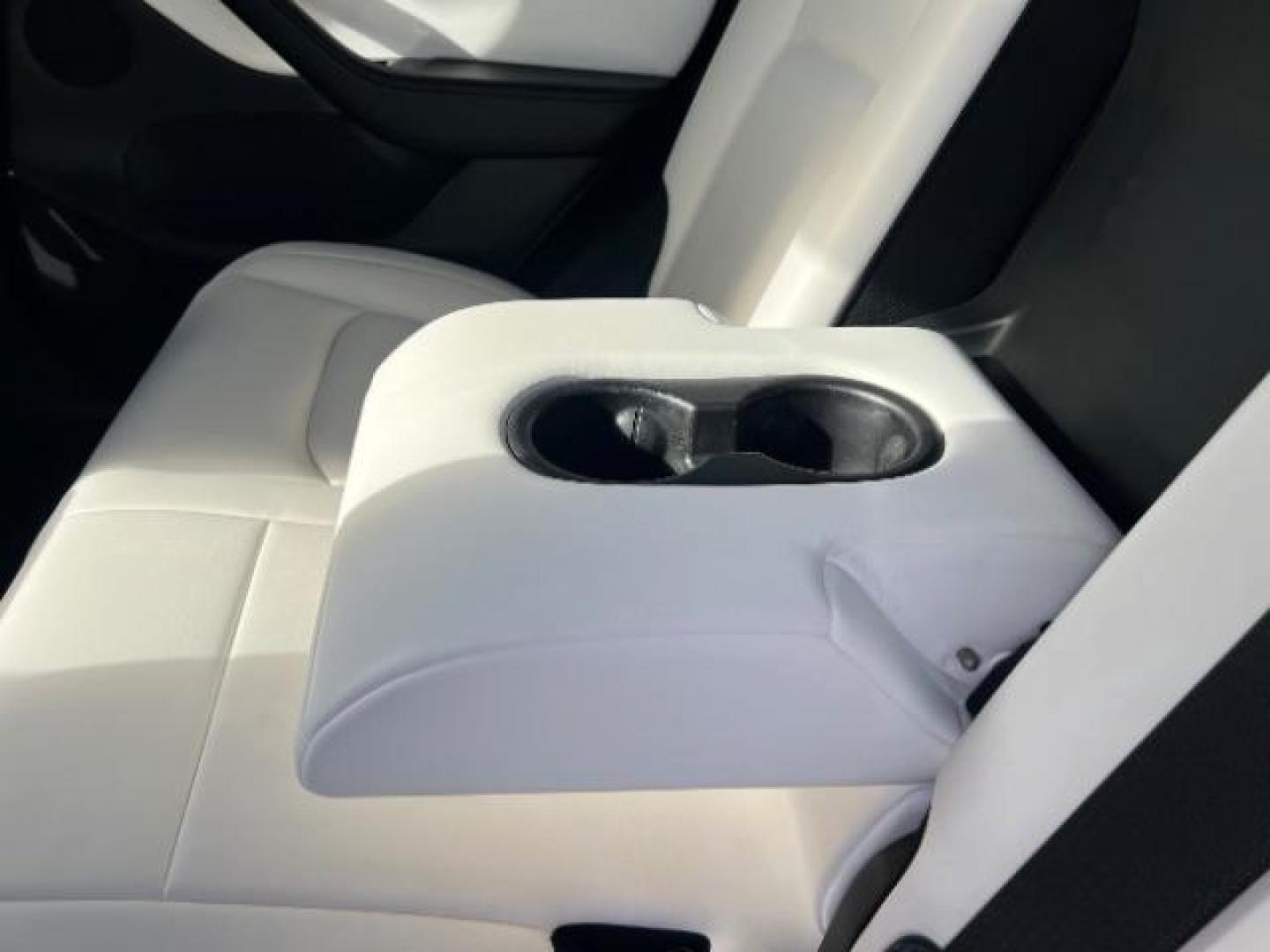 2021 White /White/Black Tesla Model Y Long Range Dual Motor All-Wheel Drive (5YJYGDEE5MF) with an ELECTRIC engine, Electric transmission, located at 1865 East Red Hills Pkwy, St. George, 84770, (435) 628-0023, 37.120850, -113.543640 - Excellent Tesla Model Y Long Range All Wheel Drive. With Full Self Drive paid for ($8k add on) Which is no longer available to buy. All our Teslas come with charging kit. Color changing wrap is a little rough but will still turn heads. Battery is healthy. Gets 275 on full charge. Clean title, no a - Photo#22