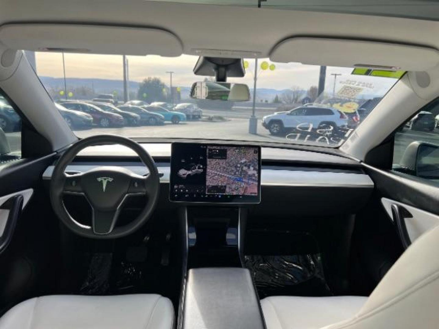 2021 White /White/Black Tesla Model Y Long Range Dual Motor All-Wheel Drive (5YJYGDEE5MF) with an ELECTRIC engine, Electric transmission, located at 1865 East Red Hills Pkwy, St. George, 84770, (435) 628-0023, 37.120850, -113.543640 - Excellent Tesla Model Y Long Range All Wheel Drive. With Full Self Drive paid for ($8k add on) Which is no longer available to buy. All our Teslas come with charging kit. Color changing wrap is a little rough but will still turn heads. Battery is healthy. Gets 275 on full charge. Clean title, no a - Photo#23