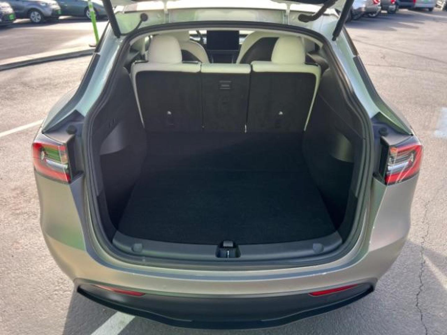 2021 White /White/Black Tesla Model Y Long Range Dual Motor All-Wheel Drive (5YJYGDEE5MF) with an ELECTRIC engine, Electric transmission, located at 1865 East Red Hills Pkwy, St. George, 84770, (435) 628-0023, 37.120850, -113.543640 - Excellent Tesla Model Y Long Range All Wheel Drive. With Full Self Drive paid for ($8k add on) Which is no longer available to buy. All our Teslas come with charging kit. Color changing wrap is a little rough but will still turn heads. Battery is healthy. Gets 275 on full charge. Clean title, no a - Photo#24