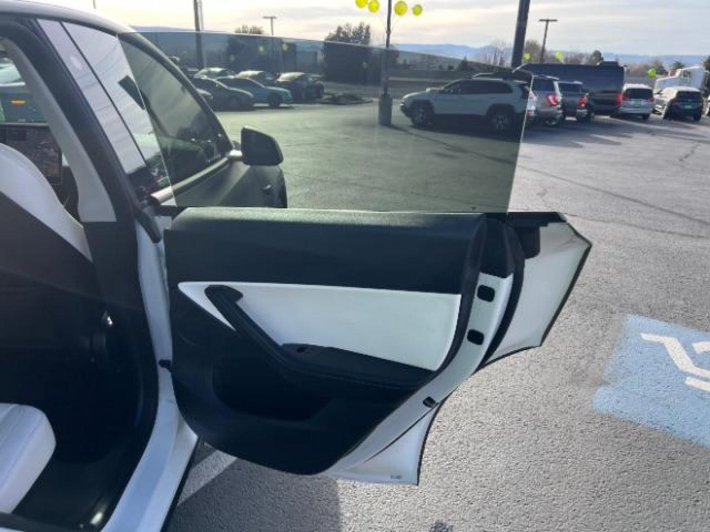 2021 White /White/Black Tesla Model Y Long Range Dual Motor All-Wheel Drive (5YJYGDEE5MF) with an ELECTRIC engine, Electric transmission, located at 1865 East Red Hills Pkwy, St. George, 84770, (435) 628-0023, 37.120850, -113.543640 - Excellent Tesla Model Y Long Range All Wheel Drive. With Full Self Drive paid for ($8k add on) Which is no longer available to buy. All our Teslas come with charging kit. Color changing wrap is a little rough but will still turn heads. Battery is healthy. Gets 275 on full charge. Clean title, no a - Photo#25